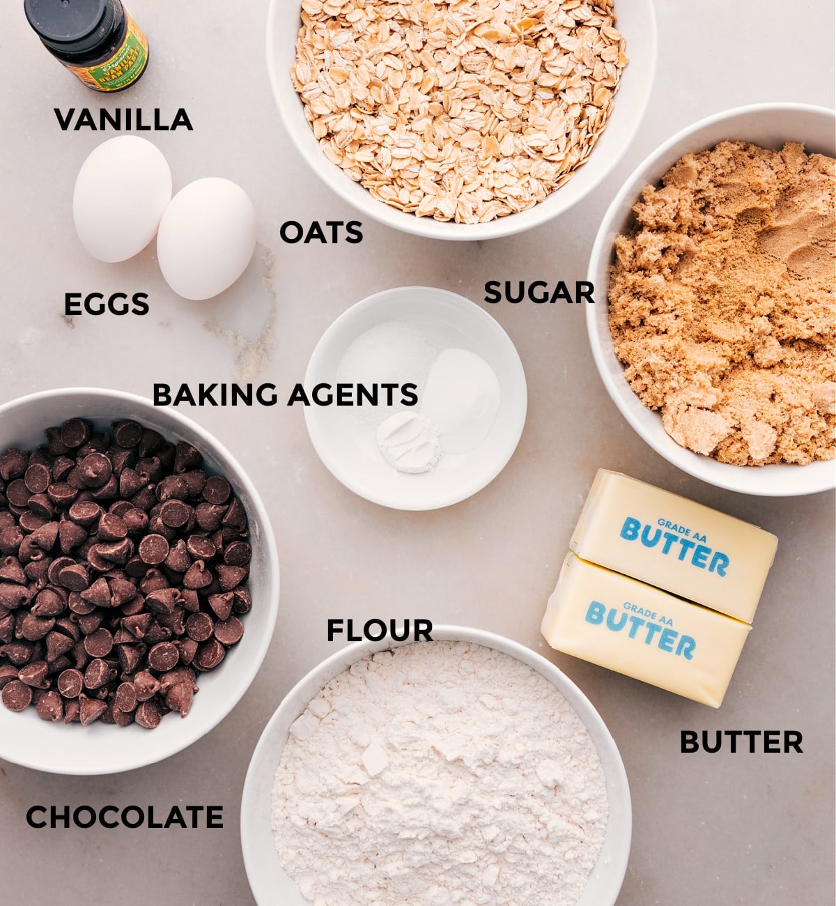 Ingredients In Brown Butter Oatmeal Chocolate Chip Cookies All the ingredients in this recipe—flour, chocolate, butter, sugar, oats, vanilla, eggs, and baking agents—are prepped and ready for easy assembly.