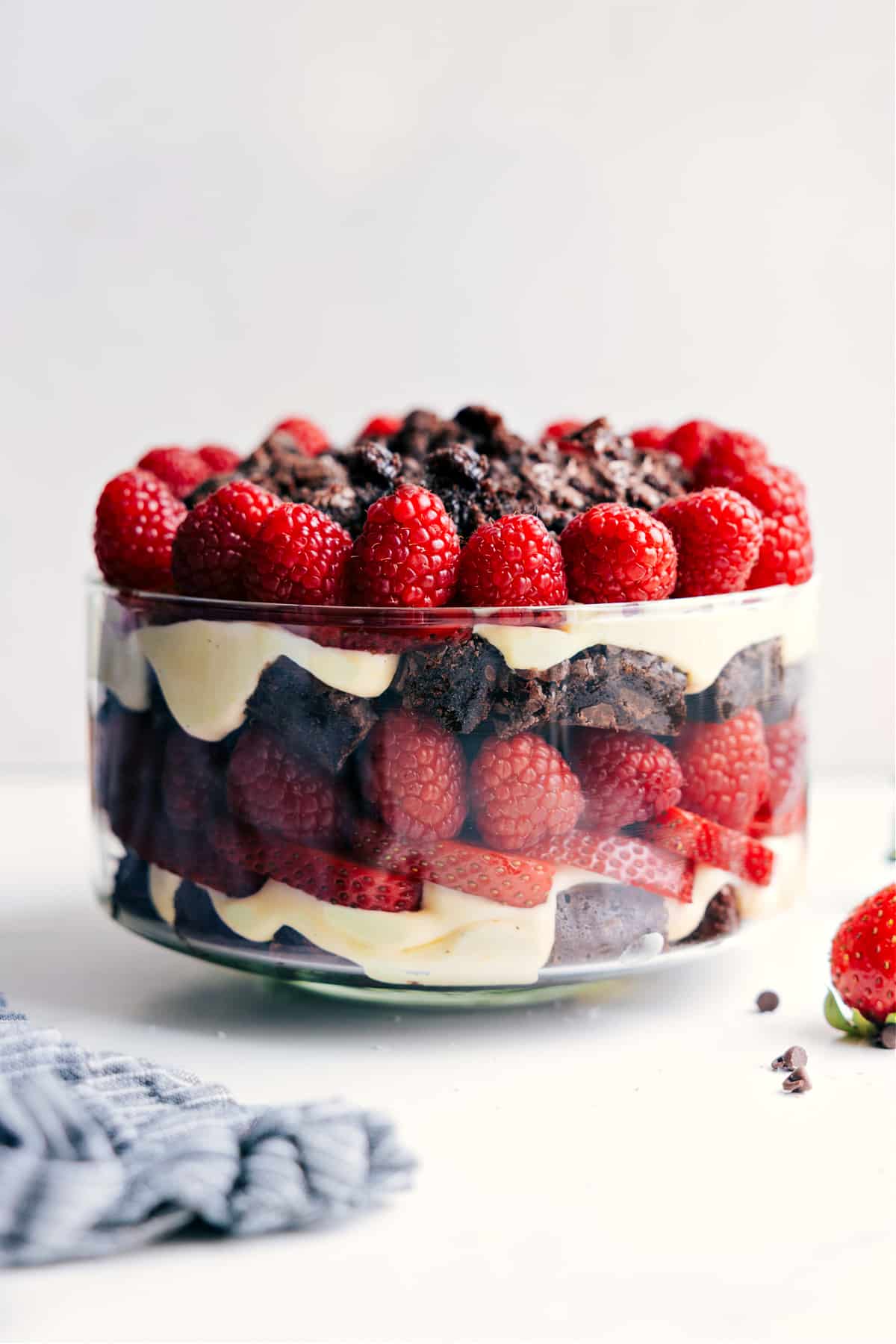Delicious Brownie Trifle with Layers of Brownies, Fruit, and Cream Brownie trifle layered with chocolate brownies, creamy filling, and topped with fresh raspberries.