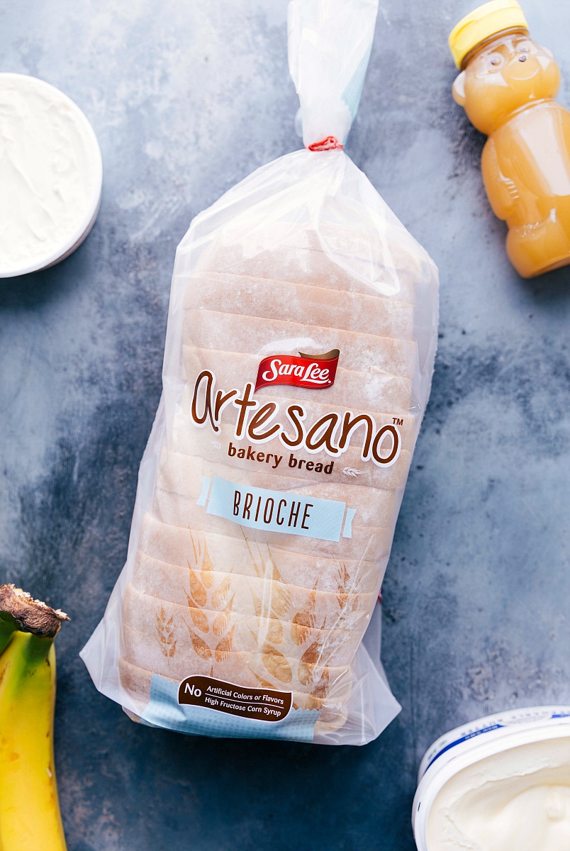 This Honey and Banana Grilled Cheese Sandwich is the BEST -- honestly good enough to pass as a dessert! It all starts with rich buttered brioche bread that is covered in creamy mascarpone cheese with thick banana slices, a drizzle of honey, and a sprinkle of cinnamon. The bread and bananas get caramelized as they're grilled, which results in an explosion of flavor and the perfect sweetness. Recipe via chelseasmessyapron #healthy #whole #breakfast #snack #best #quick #easy #bread #honey #banana #sandwich Overhead image of the brioche bread used in this recipe