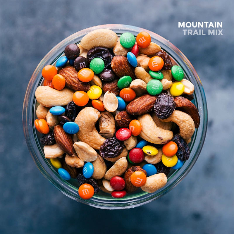 Flavorful Assortment of Snack Mix in Glass Jar Glass jar filled with finished snack, showcasing an array of complementing flavors from various ingredients.