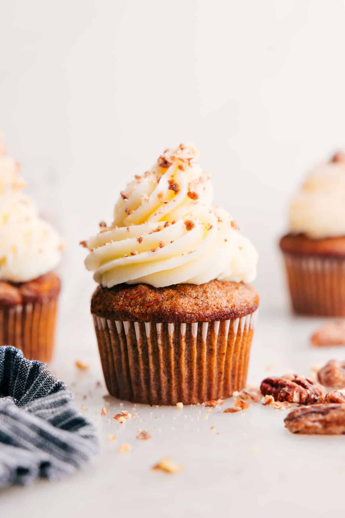 Carrot Cake Cupcakes with cream cheese frosting on top.