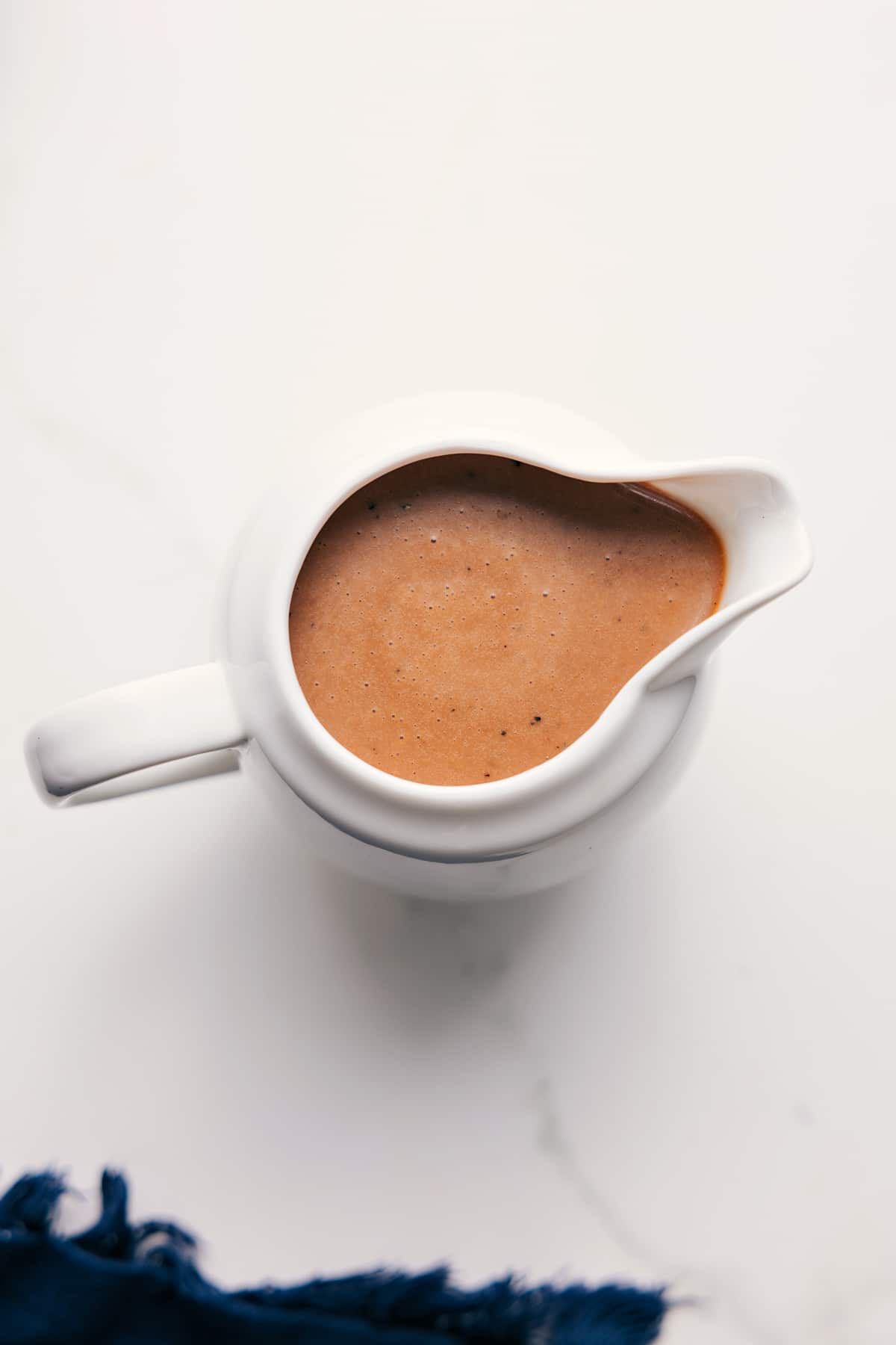 Creamy Balsamic Dressing Recipe Creamy Balsamic Dressing Recipe in a pitcher ready to pour.