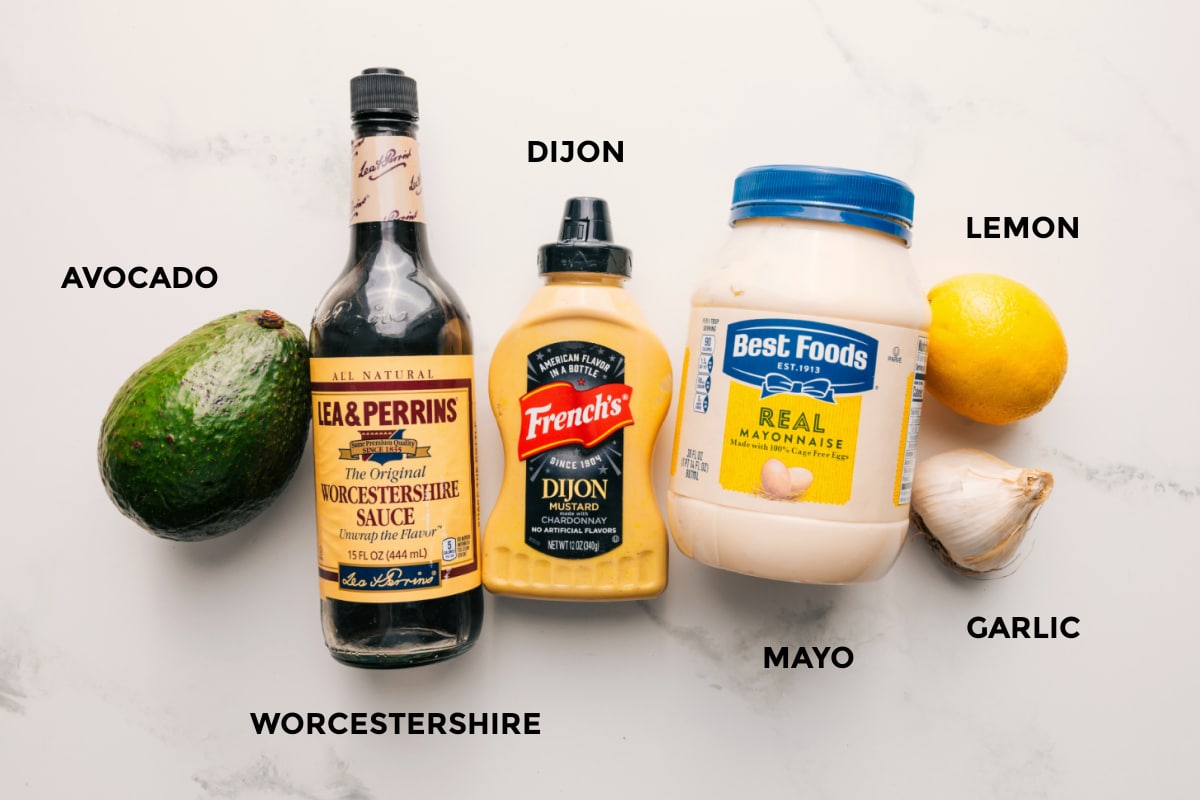 Ingredients For The Delicious Creamy Dressing All the ingredients in this kale and avocado salad prepped out for easy assembly including the avocado, worcestershire, dijon, mayo, lemon, and garlic.