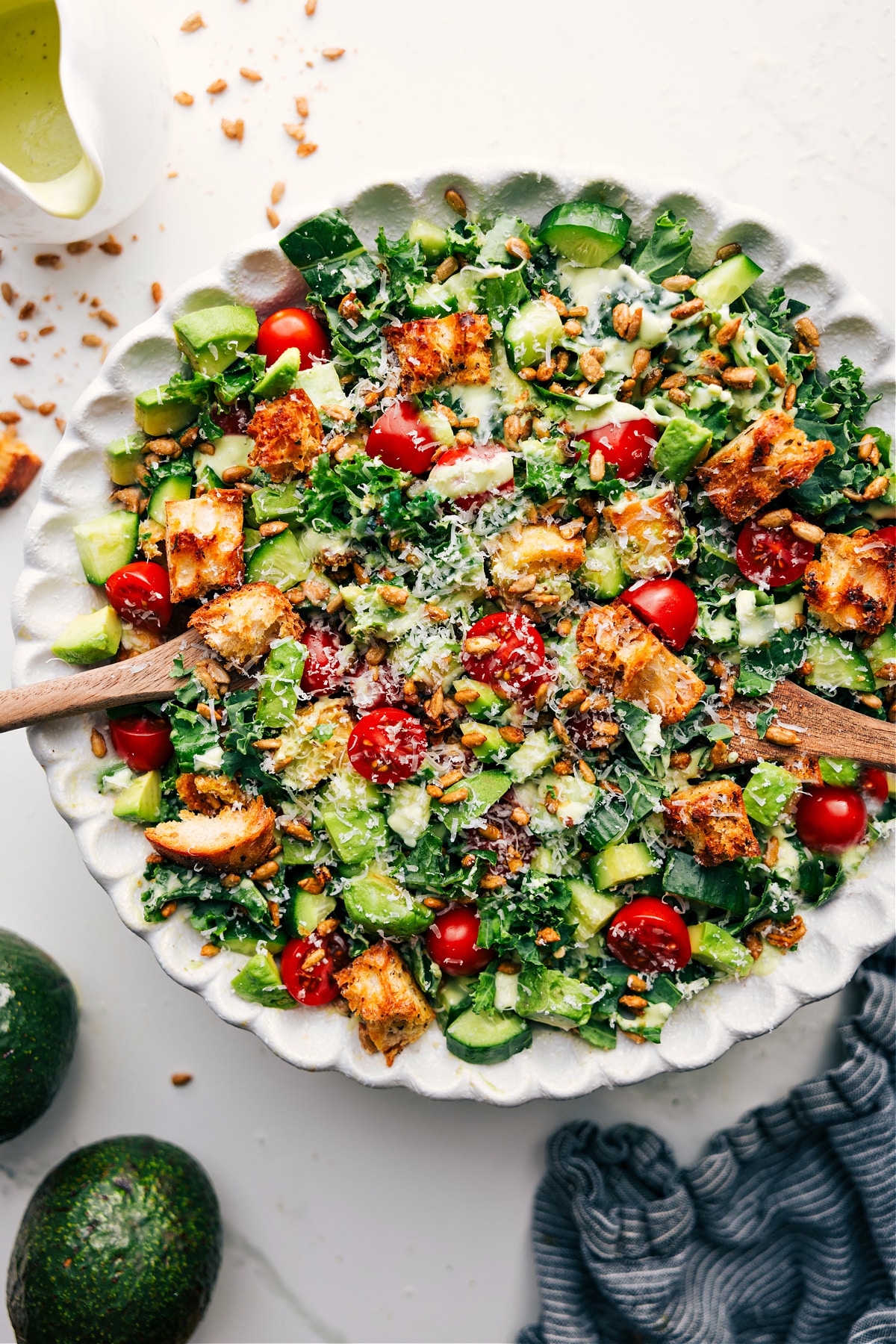 Kale And Avocado Salad dressed and ready to be tossed together and enjoyed.