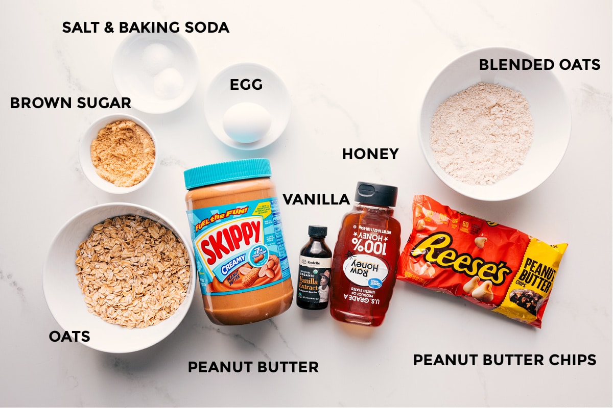 Ingredients In Oatmeal Bars Recipe All the ingredients in this recipe prepped out for easy assembly including the brown sugar, salt, baking soda, oats, egg, peanut butter, vanilla, honey, blended oats, and peanut butter chips.