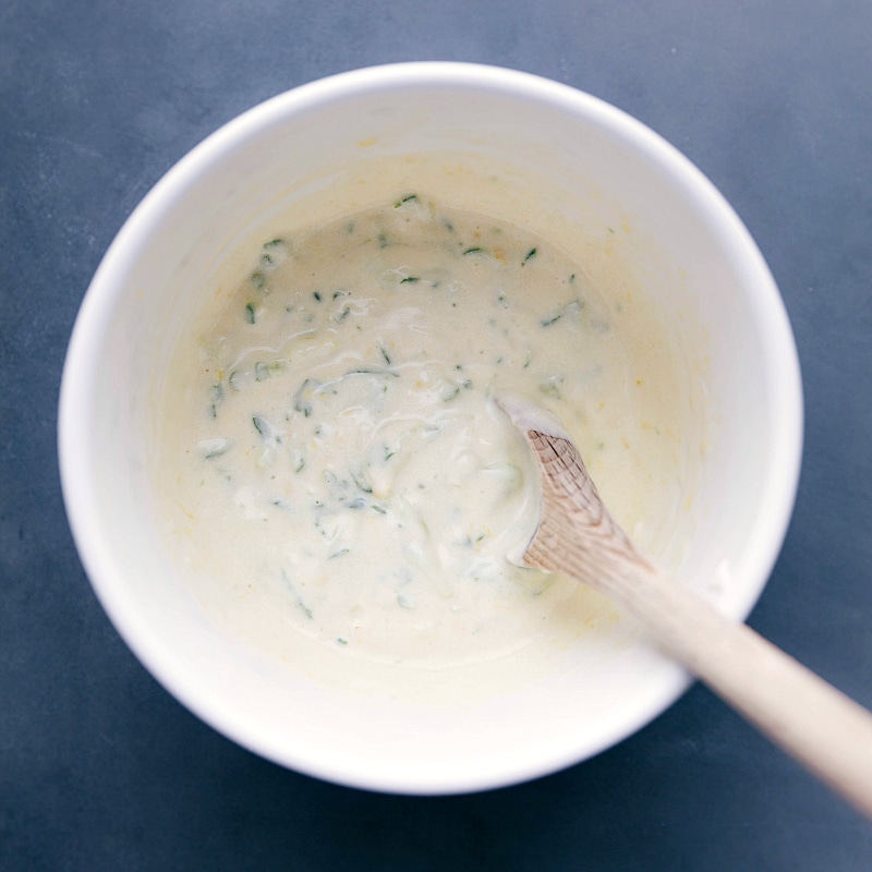 Bowl of Tangy Tzatziki Sauce - Creamy and Flavorful A bowl of delicious and tangy tzatziki sauce, creamy and ready to accompany the recipe.