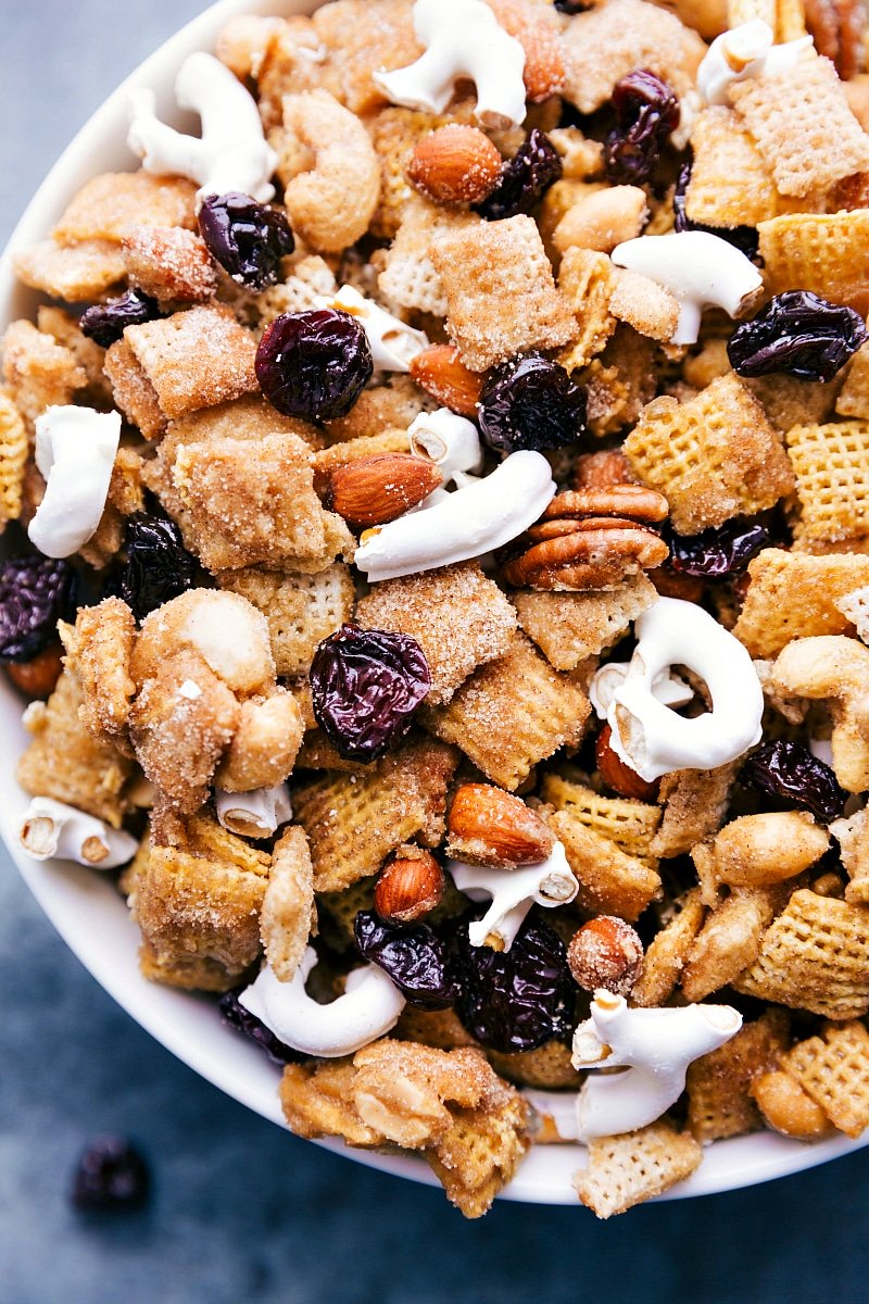 This addicting Dried Cherry Snack Mix is loaded with cereal, nuts, dried tart cherries, yogurt-covered pretzels, and covered in a cinnamon-sugar coating.ย Recipe via chelseasmessyapron #pretzels #nuts #almonds #dried #tart #cherry #sweet #snack #mix Dried Tart Cherry Snack Mix