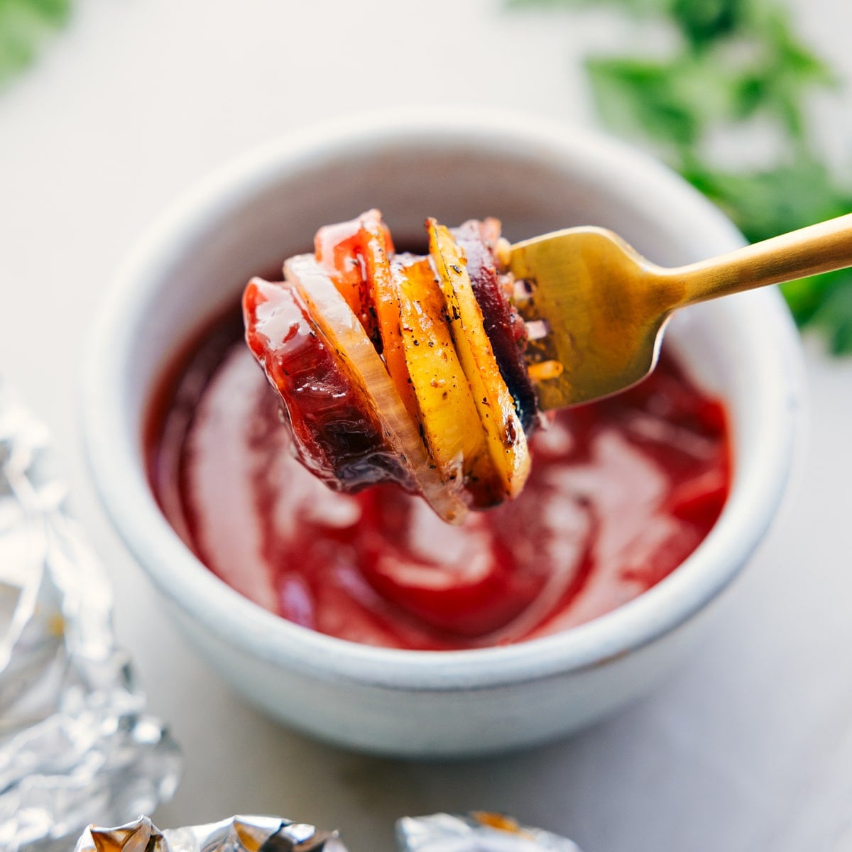How To Make Hobo Foil Packets A bite of the hobo foil packets dipped in ketchup.