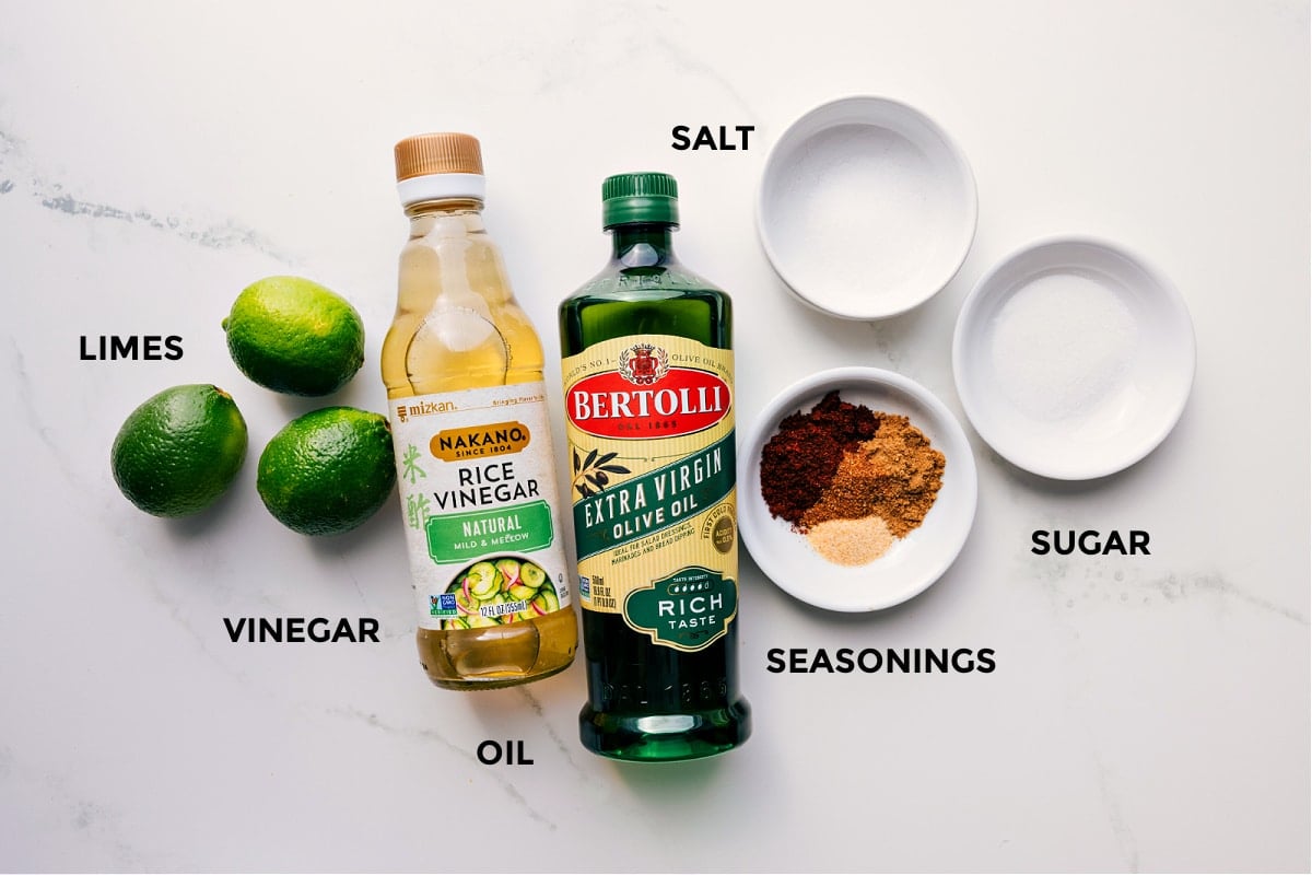 Ingredients In The Dressing For Mexican Pasta Salad The dressing ingredients prepped for Mexican Pasta Saladโlimes, rice vinegar, olive oil, seasonings, sugar, and salt.