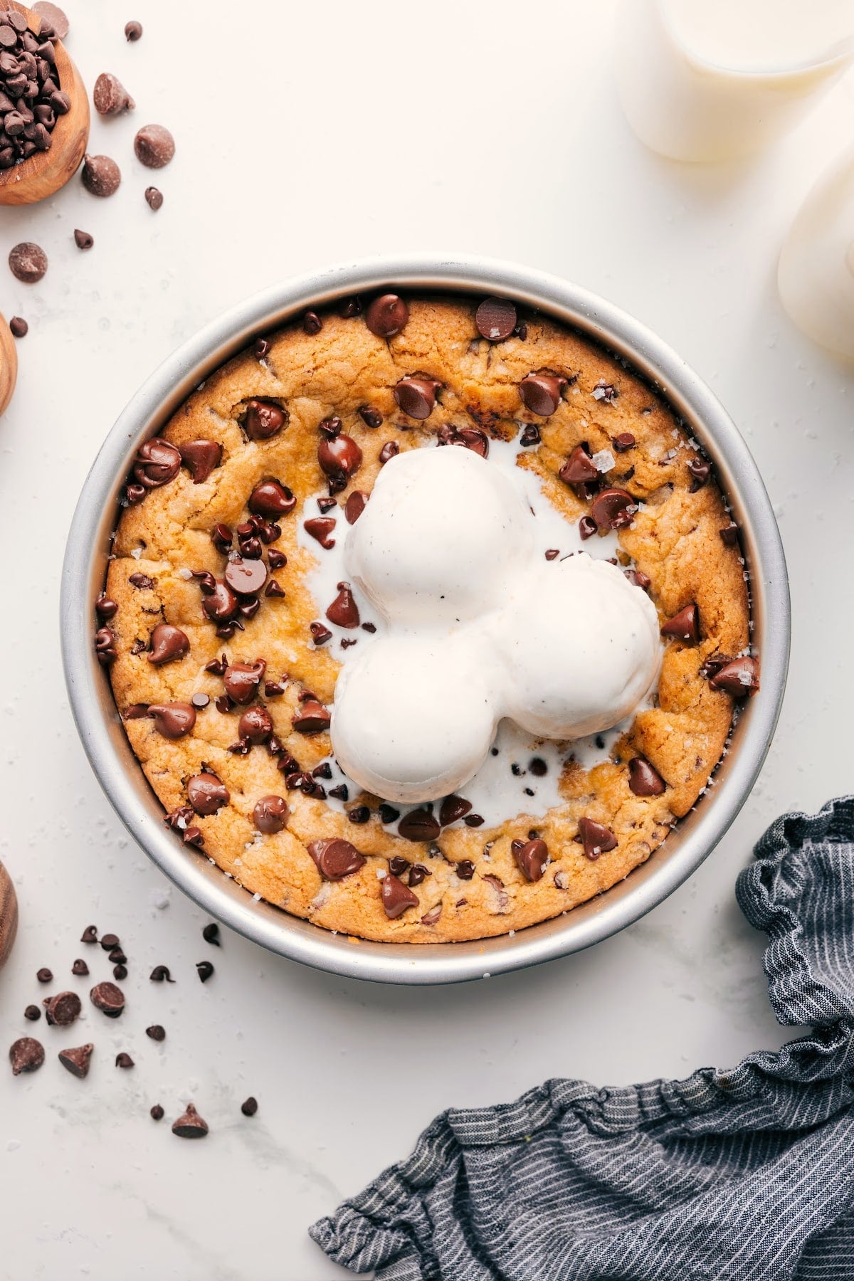 The Best Pizookie Recipe With Ice Cream Pizookie recipe fresh out of the oven topped with a scoop of melting vanilla ice cream.