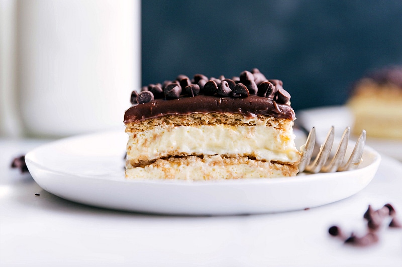 Gorgeous Slice of Chocolate Eclair Cake A delicious and gorgeous slice of chocolate eclair cake ready to be enjoyed.