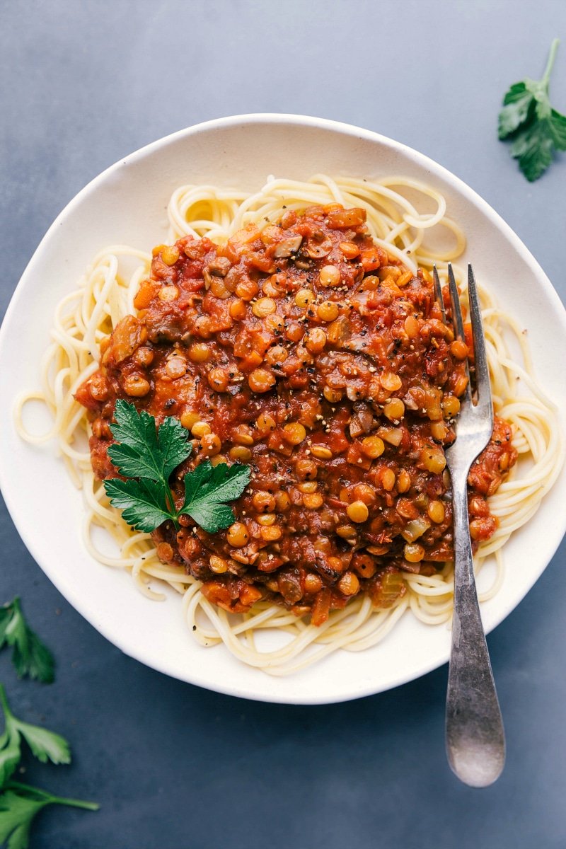 Savory Lentil Bolognese on Spaghetti - A Delicious and Fulfilling Dish Lentil bolognese served over spaghetti, presenting a savory and mouth-watering meal.