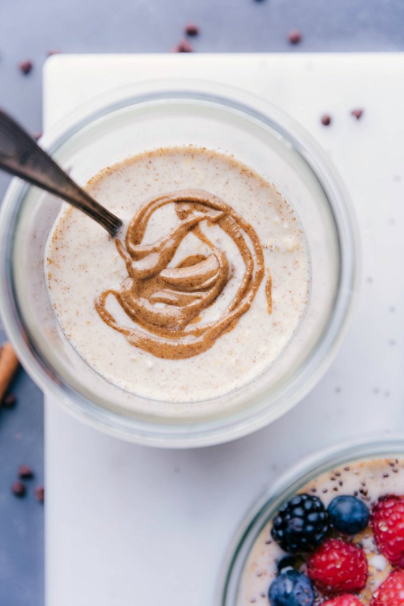 Overnight Oats Base Recipe with Swirled Almond Butter Base recipe for overnight oats in a bowl, with almond butter beautifully swirled into it.