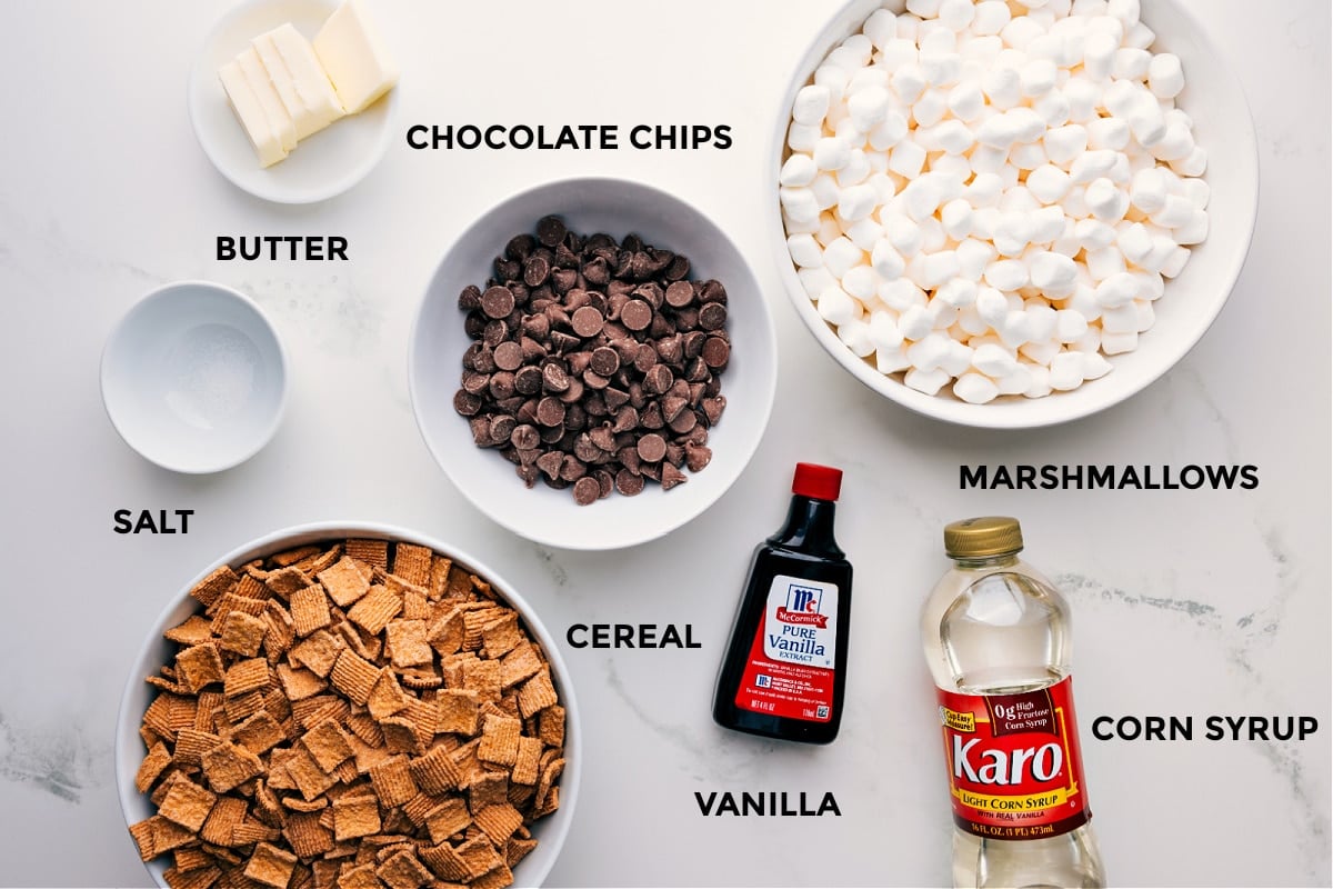 Ingredients In S'mores Cereal Bars All the ingredients for this recipe, including butter, chocolate chips, marshmallows, corn syrup, vanilla, cereal, and salt, prepped and ready for easy assembly.