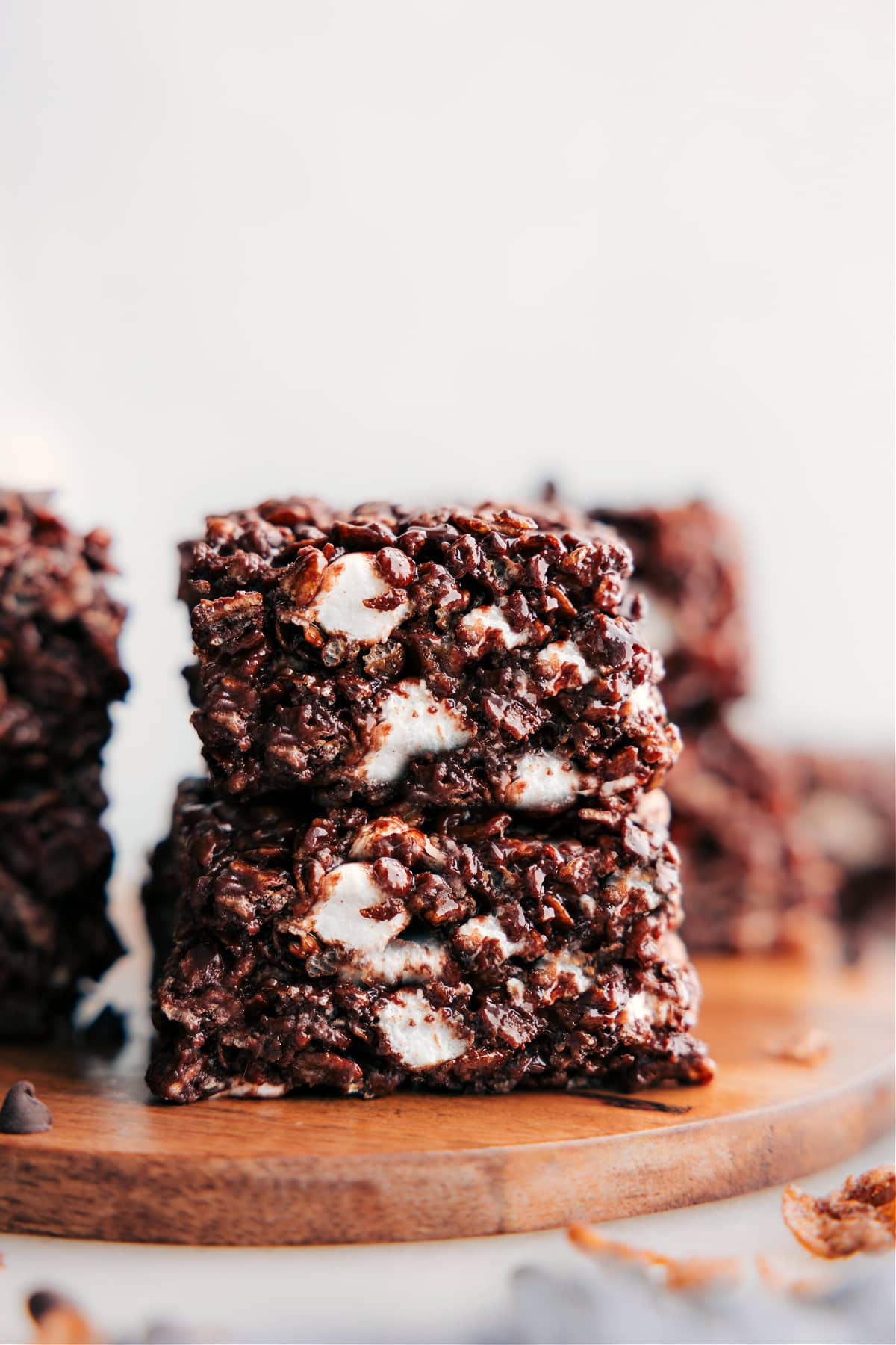 Delicious Chocolate Rice Krispie Treats The dessert cut into squares and stacked on top of each other to enjoy.