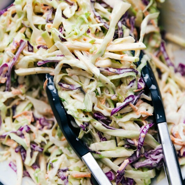 Coleslaw in a large serving bowl, fully dressed and ready for enjoyment.