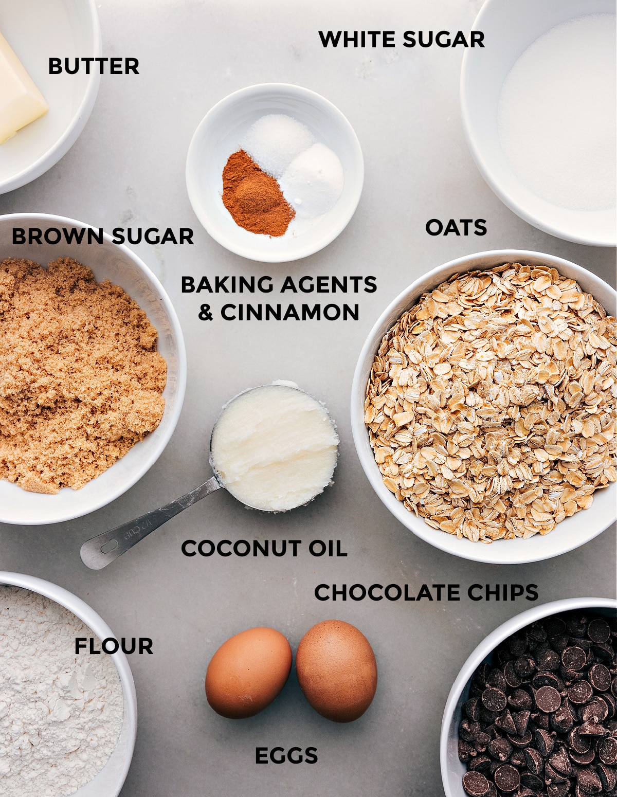 Ingredients In Coconut Oil Oatmeal Cookies Ingredients for this recipe spread out such as oatmeal, sugar, eggs, spices, and chocolate chips.