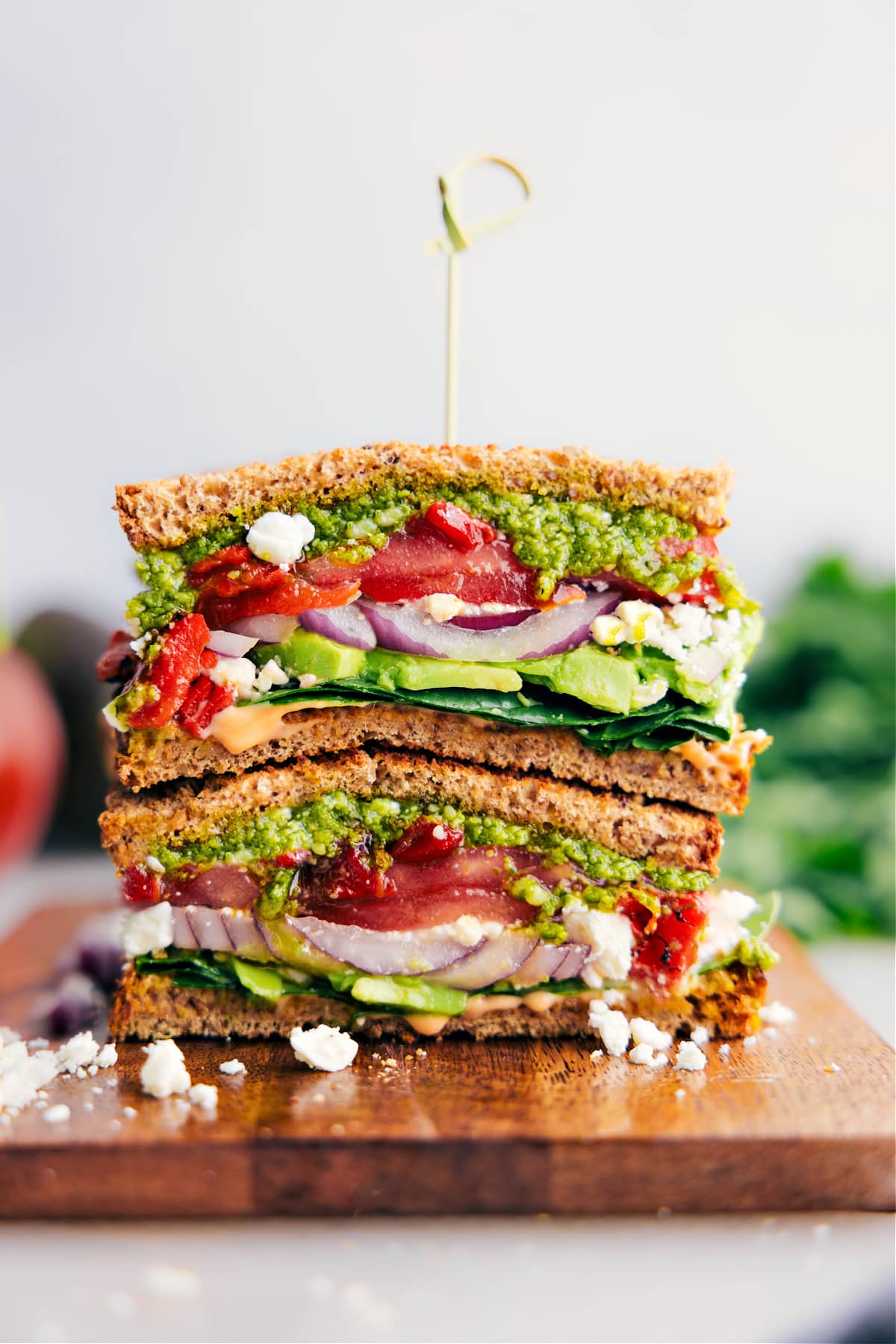 Easy, vegetarian Mediterranean Sandwich—pile veggies, creamy feta cheese, and basil pesto on hearty bread.
