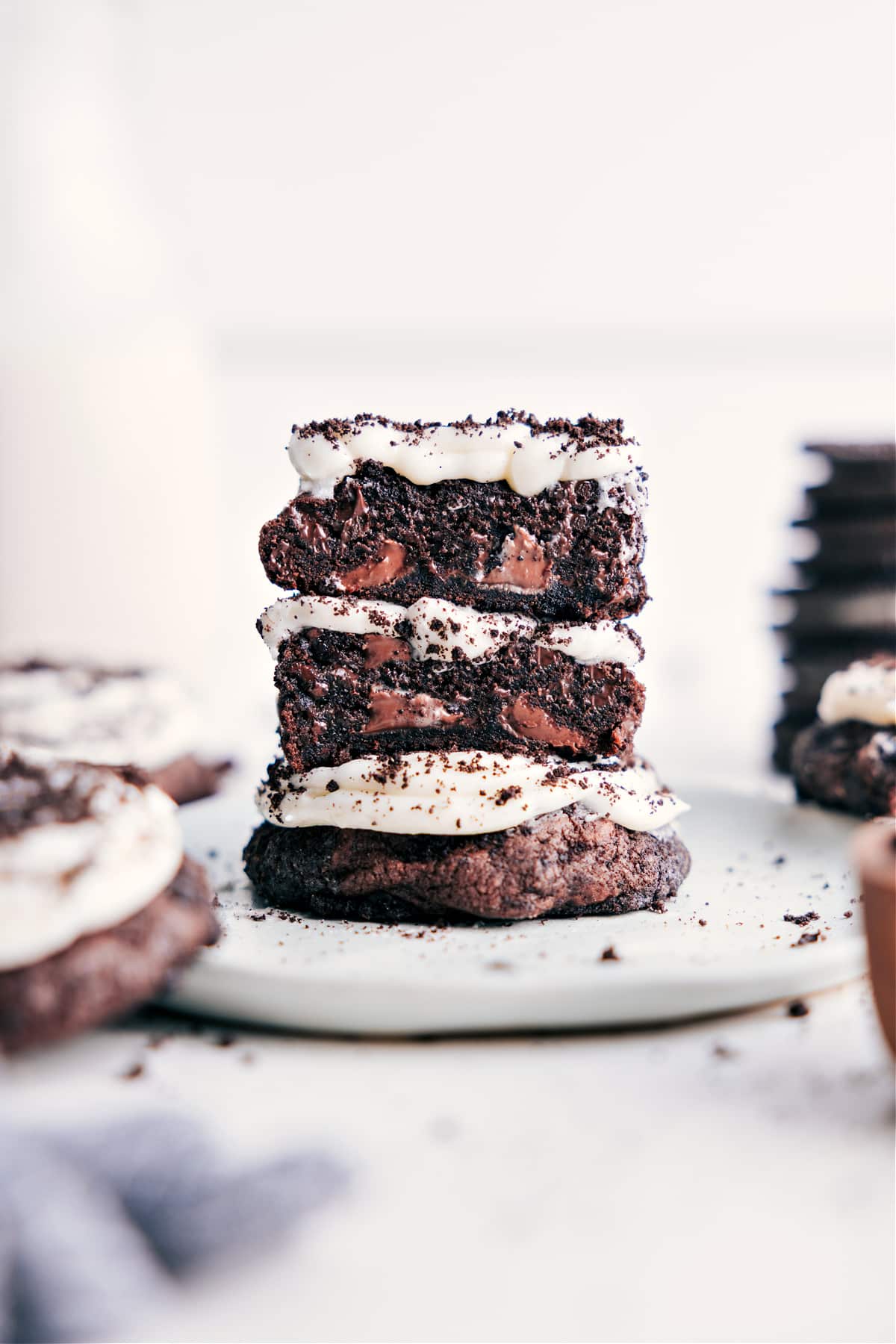 Crumbl Oreo Cookiesย are a copycat recipe of Crumbl's fan-favorite Oreo cookie recipe! These Oreo-crumb encrusted rich chocolate cookies are loaded with cream cheese frosting and garnished with crushed-up Oreos. Recipe via ChelseasMessyApron #dessert #quick #easy #simple #best #copycat #decadent #frosting #crumbl #oreo #cookies