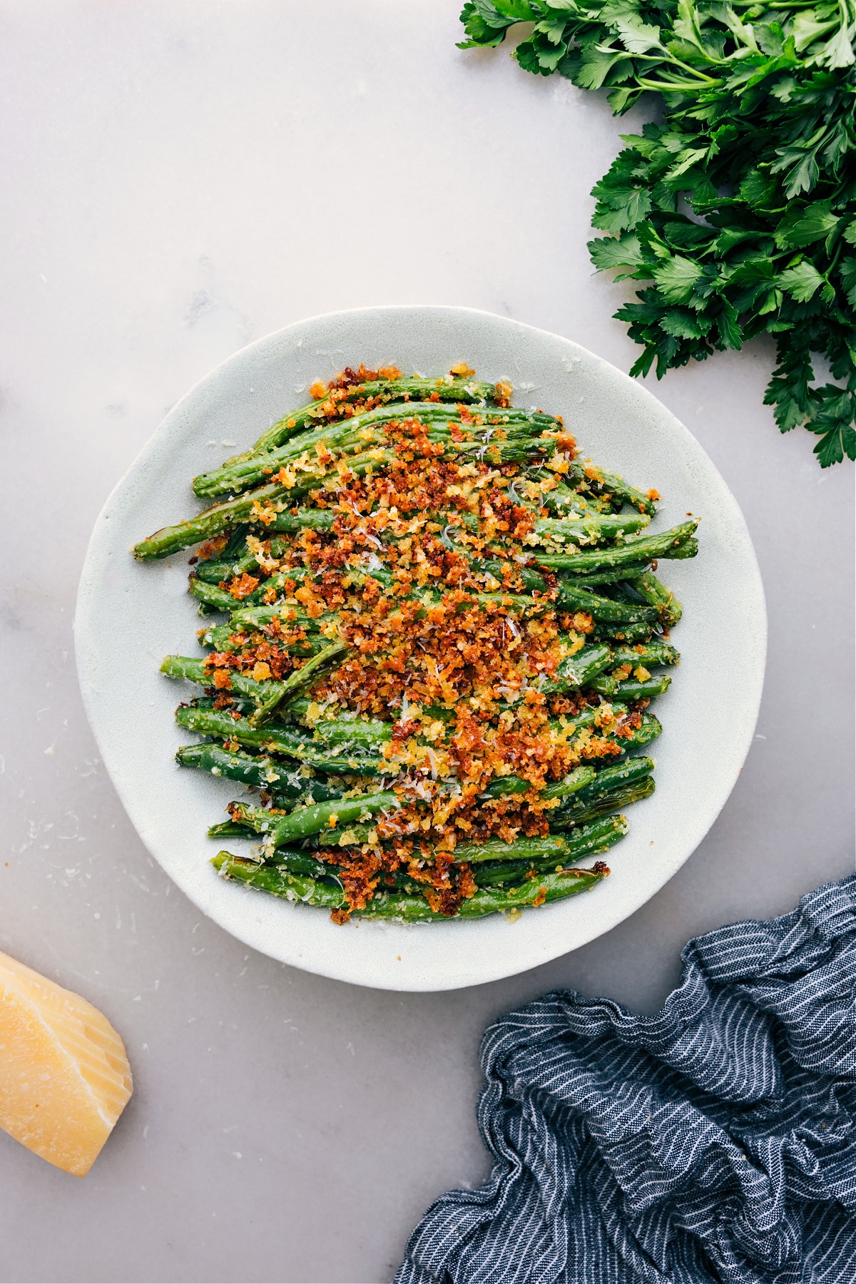 The Best And Easiest Roasted Green Beans Freshly roasted green beans straight from the oven, topped with panko and parmesan.