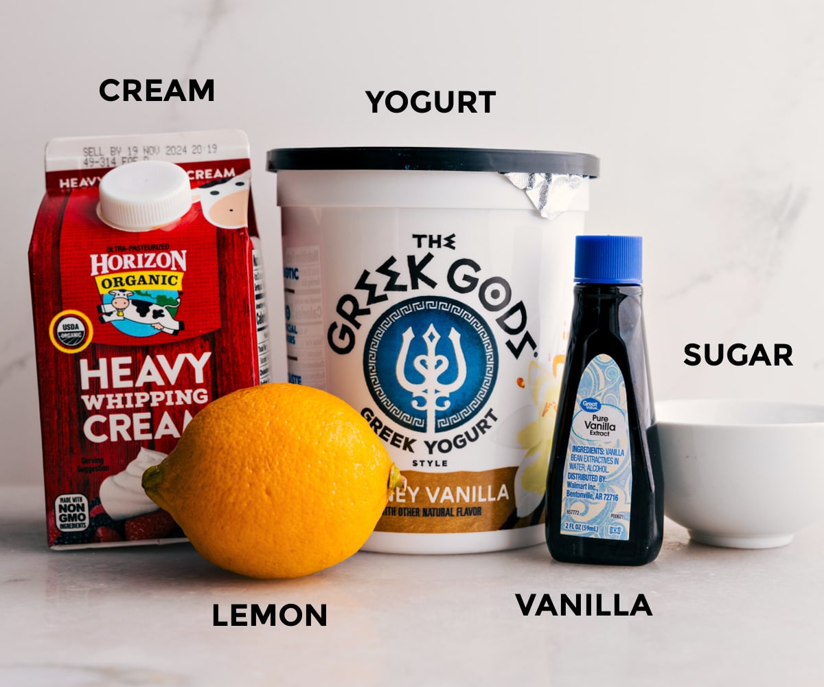 Whipped Cream Layer Being Made The ingredients in the whipped cream layer for this ambrosia salad prep include yogurt, vanilla, sugar, lemon, and heavy cream.