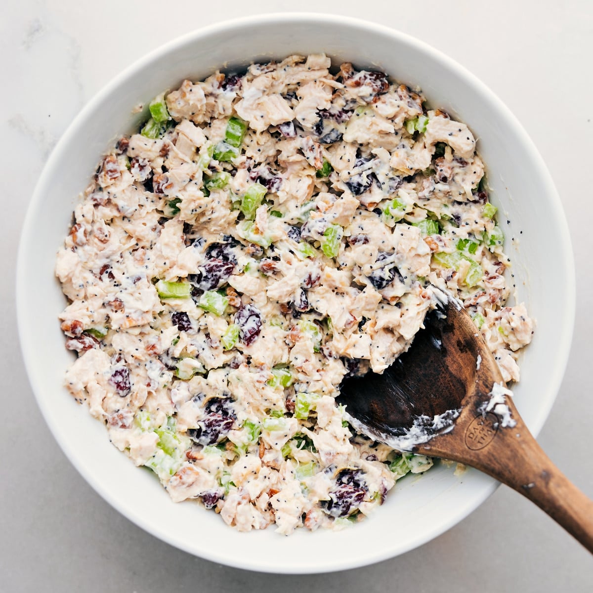 The Best, Easy Chicken Salad Recipe The chicken salad all combined in bowl ready to be served in some lettuce, on some bread, or however you enjoy it.