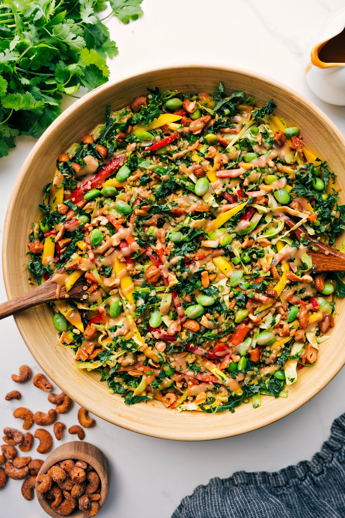 Fresh And Flavorful Thai Quinoa Salad Thai Quinoa Salad in a large bowl tossed together with dressing drizzled over the top.