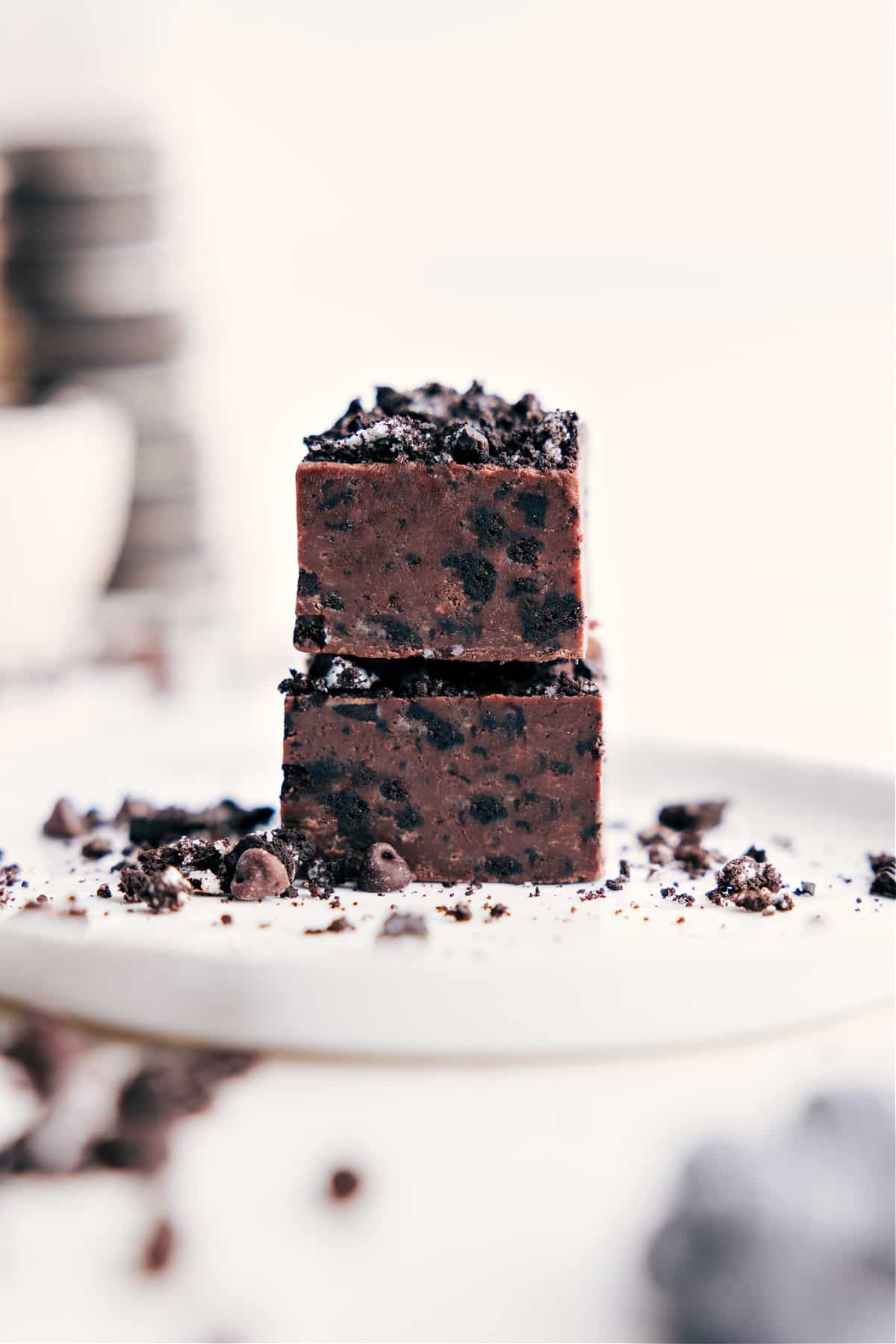 Simple and delicious Chocolate Covered Oreo Fudge stacked on top of each other.