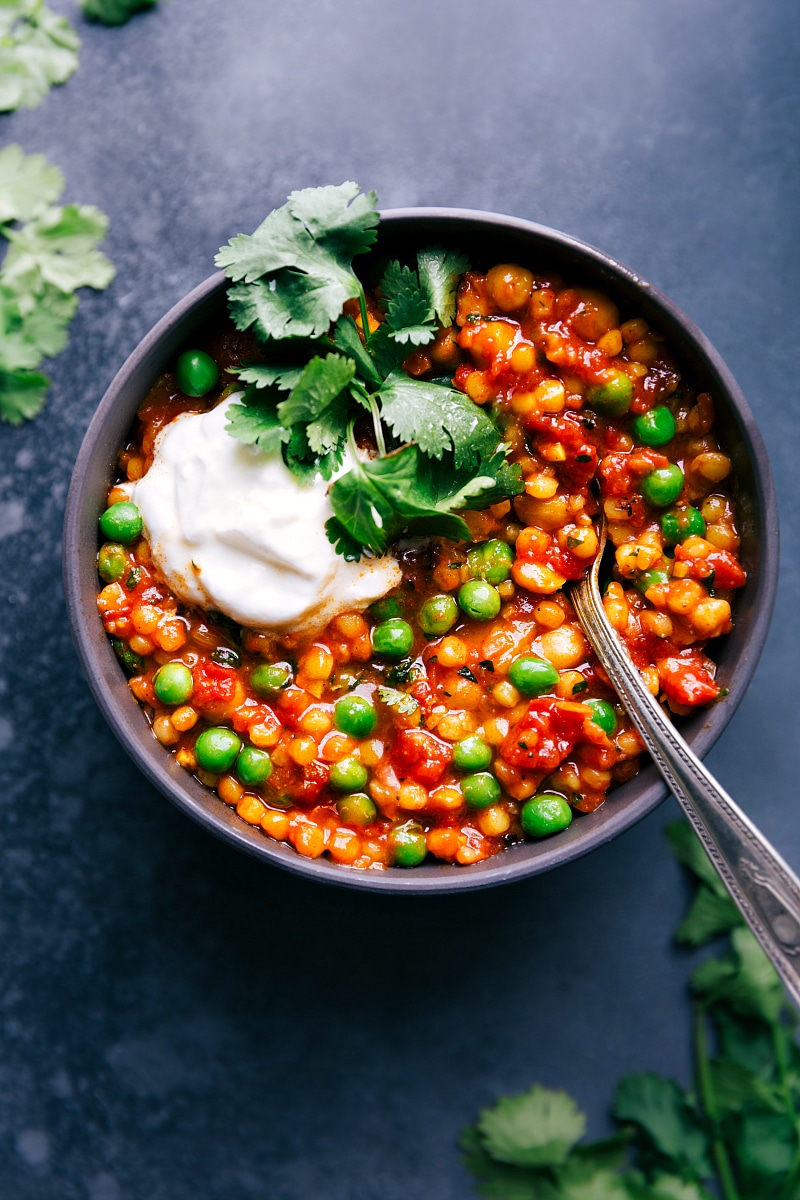 Moroccan Stew in a bowl topped with greek yogurt and cilantro.