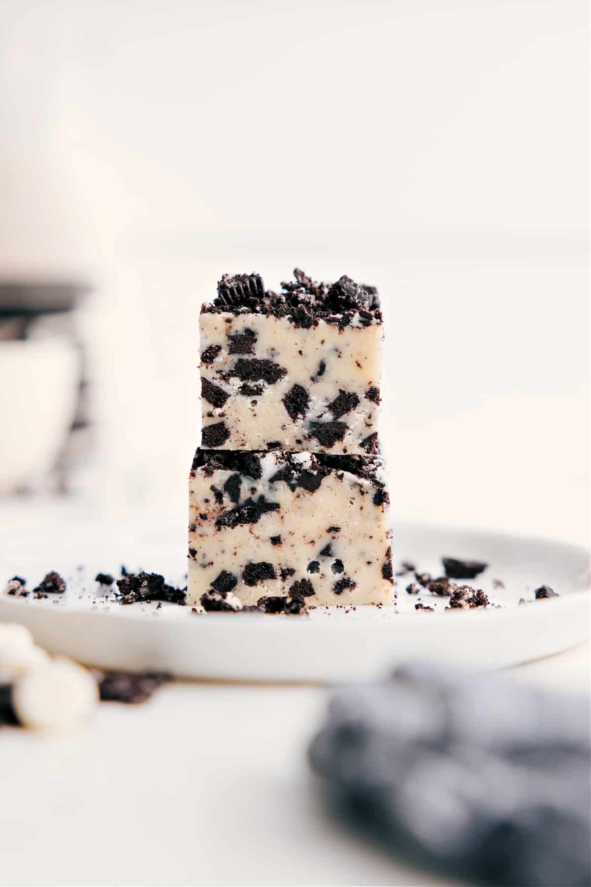 Easy And Delicious Oreo Fudge Recipe Oreo Fudge stacked on top of each other ready to be enjoyed.