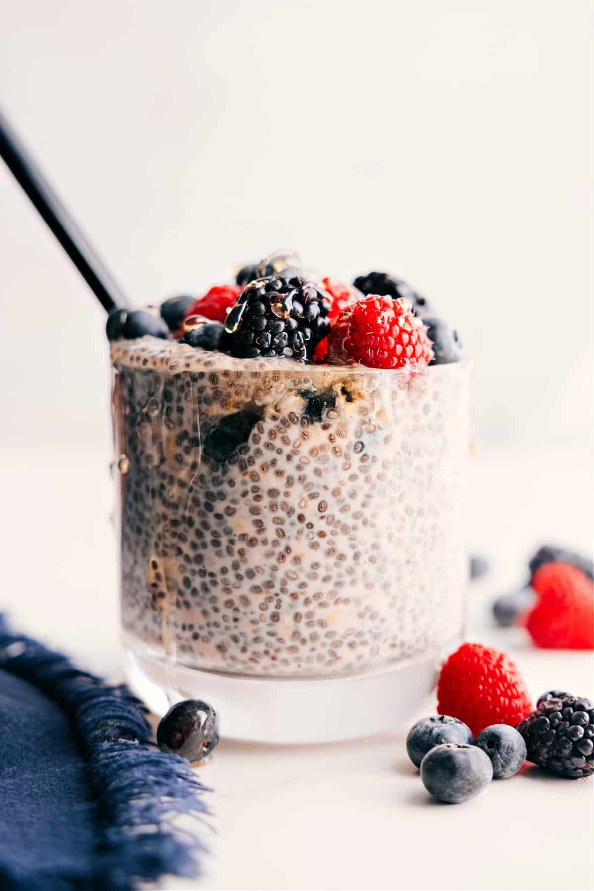 The Best Chia Pudding Recipe With Fresh Berries Chia Pudding Recipe in a jar with fresh berries and honey drizzled on top.