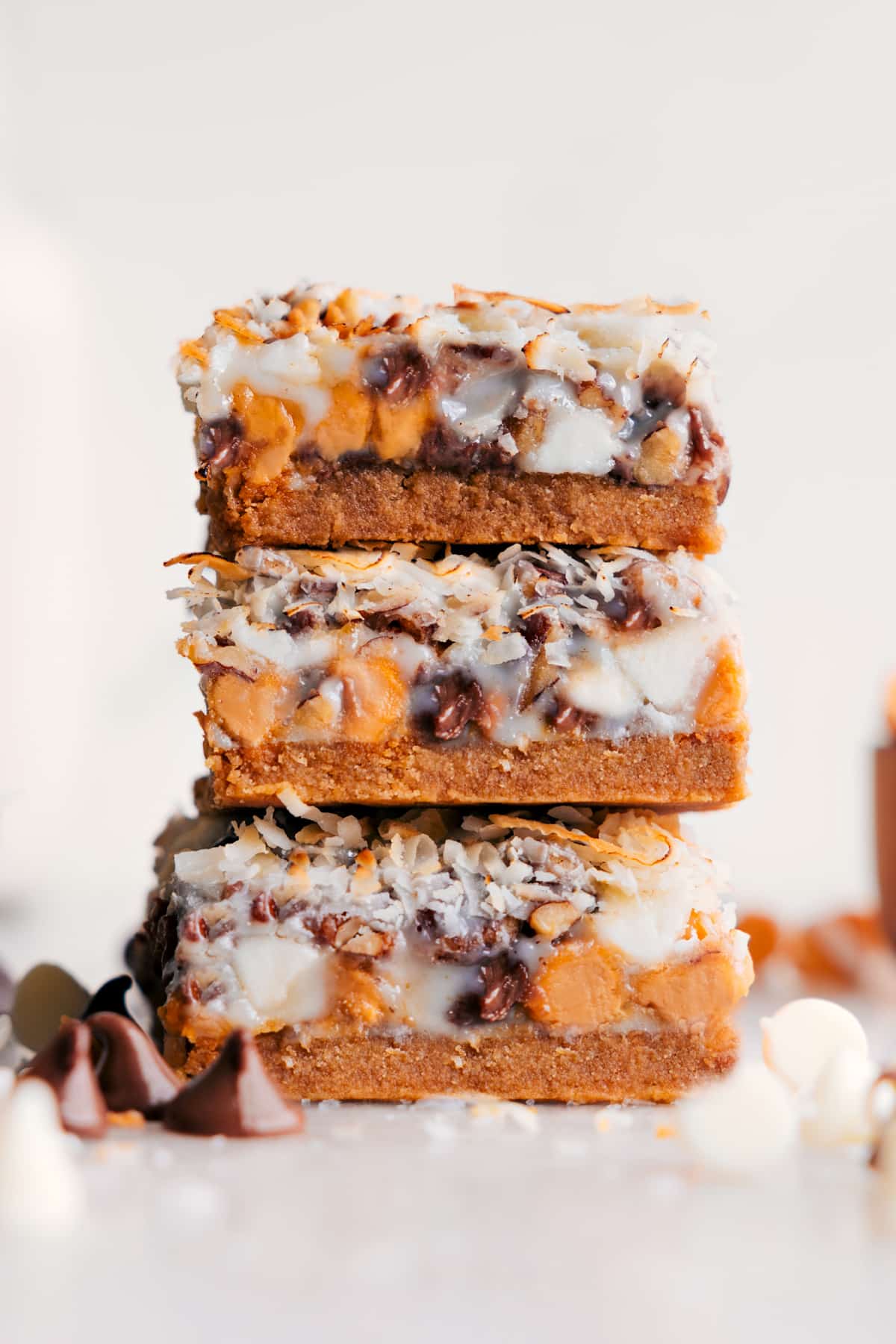 The Best 7-Layer Bars Recipe 7 Layer Bars stacked to reveal all the yummy layers.