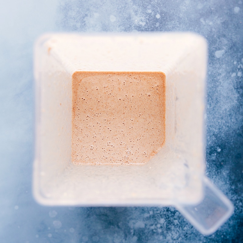 Stick with me here -- we're adding vegetables to a breakfast smoothie, but I promise you can't taste them! This Cauliflower Smoothie is sweet, filling, and tastes like a cinnamon roll in smoothie form. Recipe via chelseasmessyapron #healthy #best #quick #simple #blended #cauliflower #smoothie Image of the Cauliflower Smoothie in the blender.