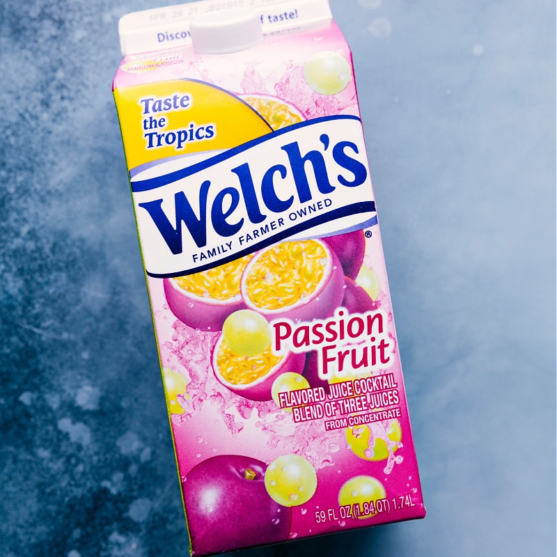 Caribbean Passion Smoothie is made with passion fruit juice, a blend of frozen fruit, ice, and orange sherbet. Recipe via chelseasmessyapron #breakfast #dessert #quick #easy #simple #best #frozen #healthy #peach #strawberry #jambajuice #caribbean #passion #smoothie Passion Fruit Juice in a carton, used in this recipe.