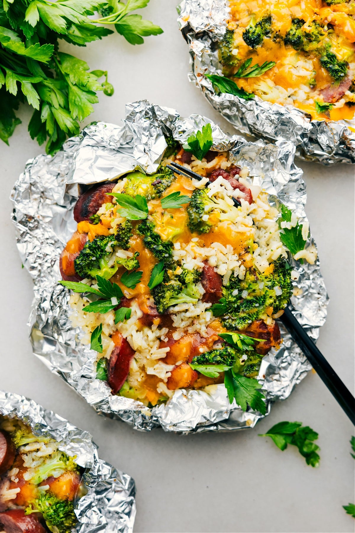 Foil Pack Cheesy Broccoli & Chicken fresh off the grill ready to be enjoyed.