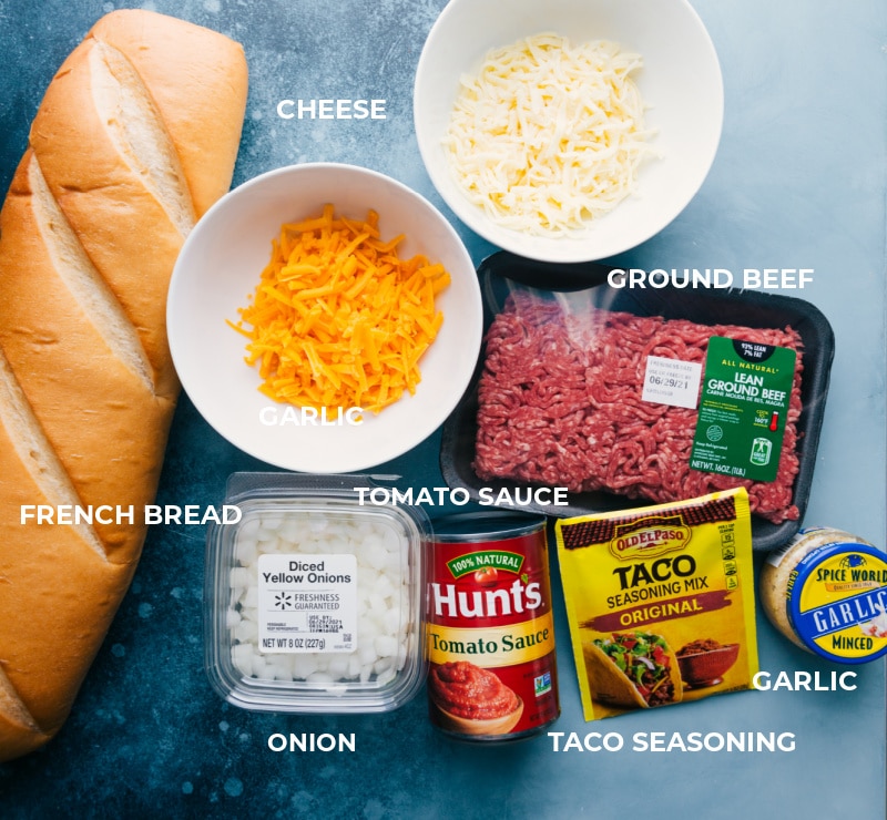 French Bread Taco Pizza takes a loaf of French bread, loads it up with taco-seasoned meat, lots of cheese, and finishes it off with your favorite taco toppings. Recipe via ChelseasMessyApron #dinner #quick #easy #simple #best #20minutedinner #cheap #frenchbread #taco #pizza Ingredient shot-- image of all the ingredients in this dish