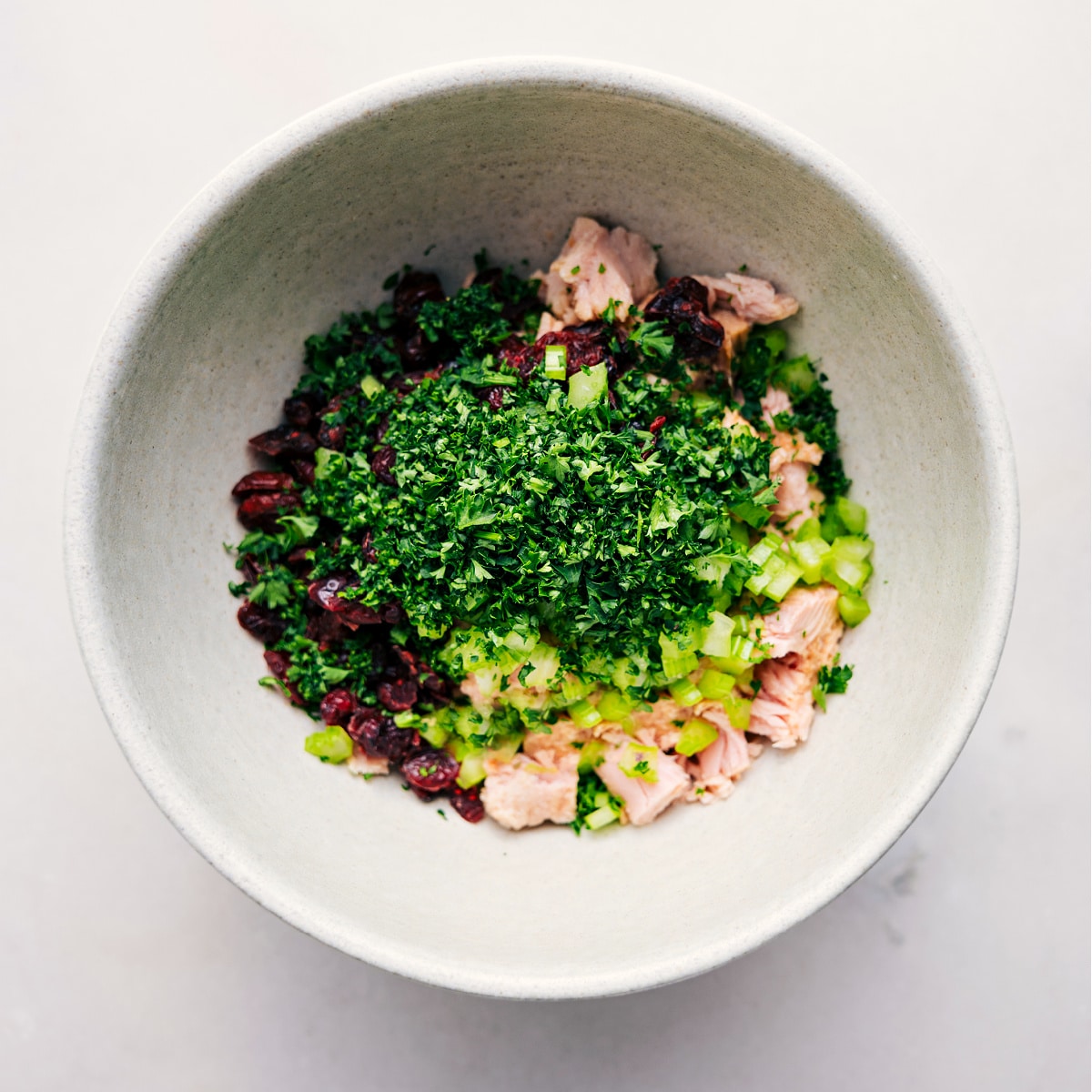 How To Make This Tuna Salad Recipe All the ingredients for this easy tuna salad go into a bowl, ready to be tossed together.