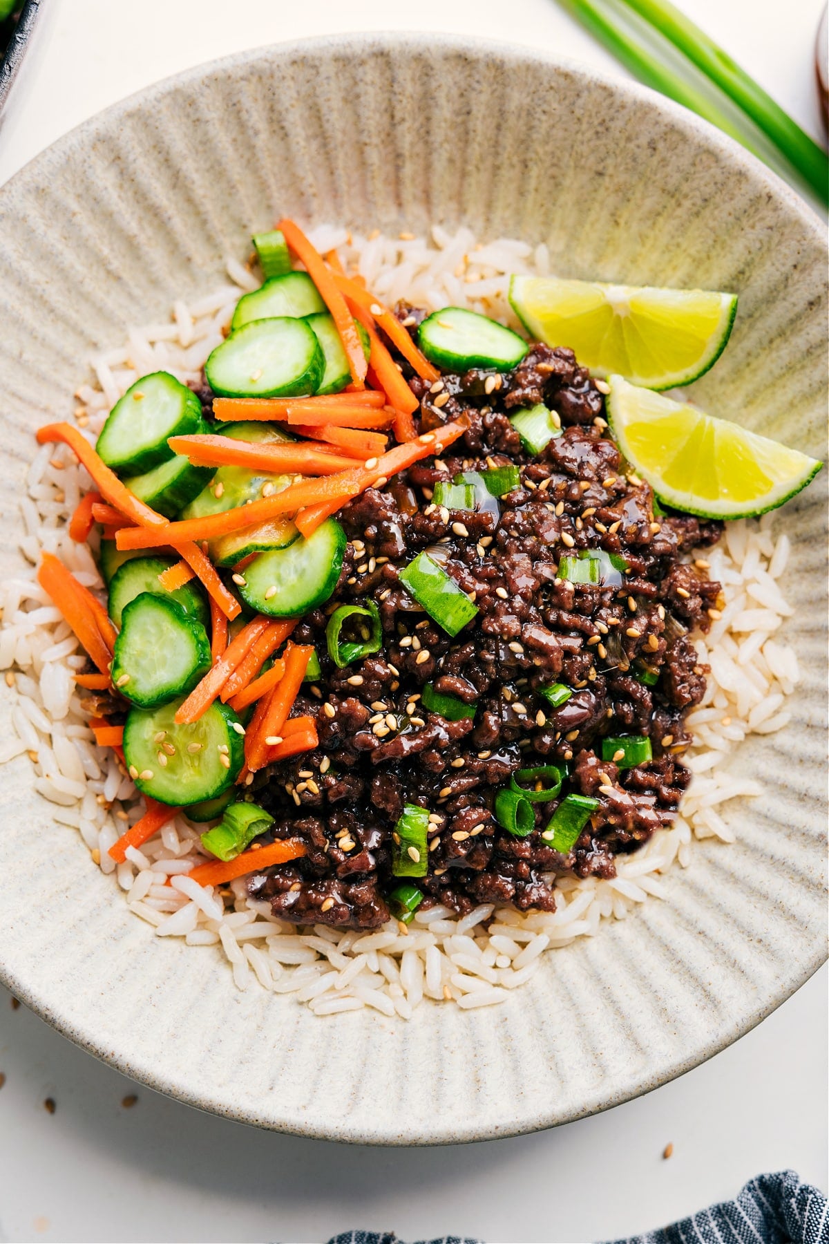 Korean Ground Beef served with a refreshing cucumber and carrot salsa on the side, all atop a bed of rice.