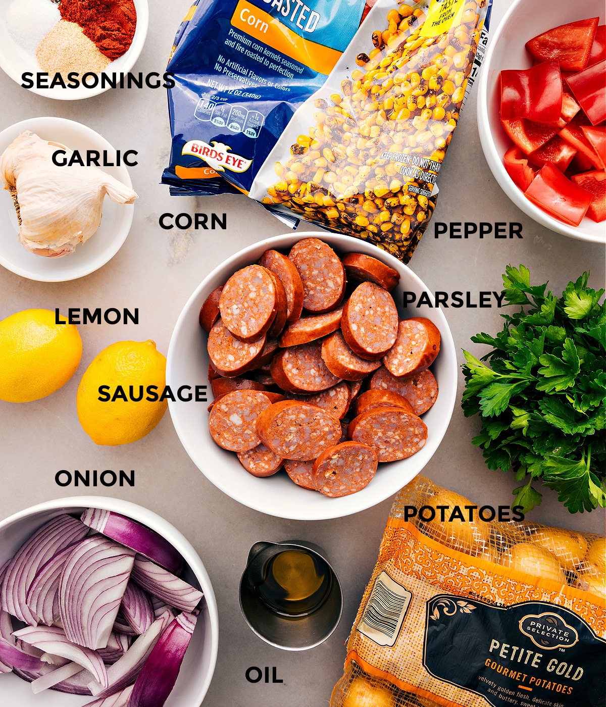Ingredients In Smoked Sausage, Potatoes, & Corn This recipe has everything prepped for easy assembly: meat, veggies, lemon, seasonings, and oil.