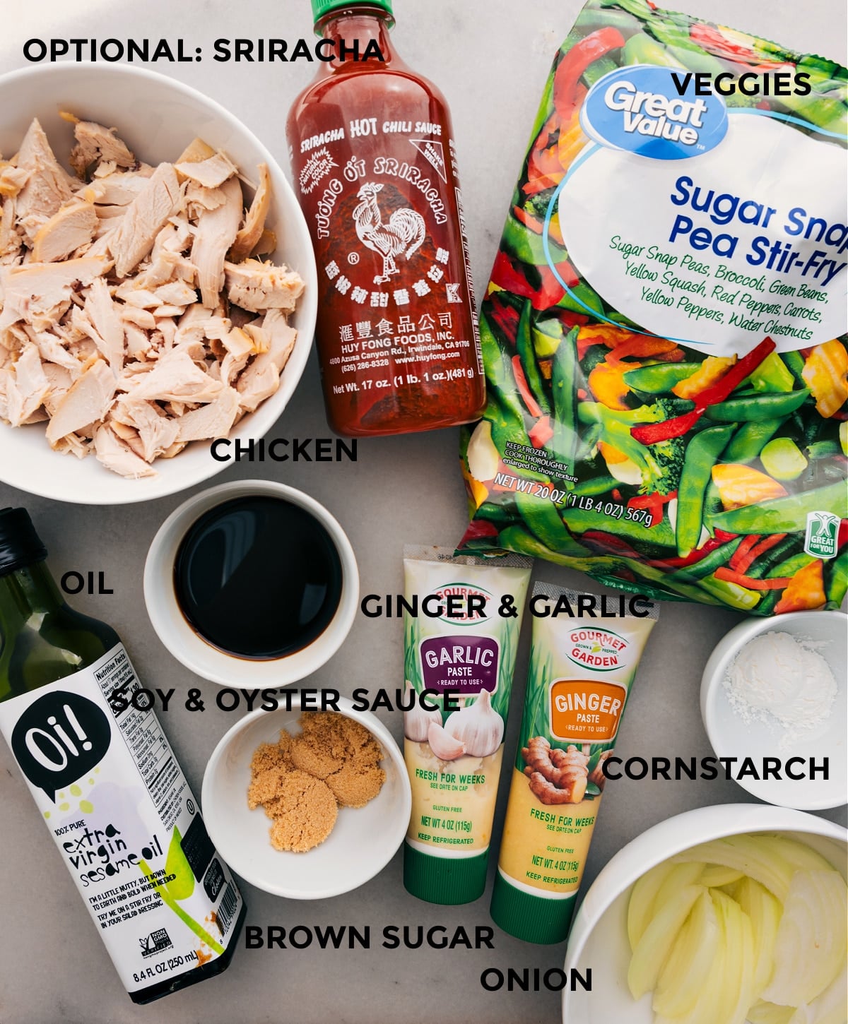 Ingredients In Rotisserie Chicken Stir Fry All the ingredients for this recipe are prepped for easy assembly: frozen veggie mix, meat, sriracha, ginger, garlic, soy sauce, oyster sauce, cornstarch, and onion.