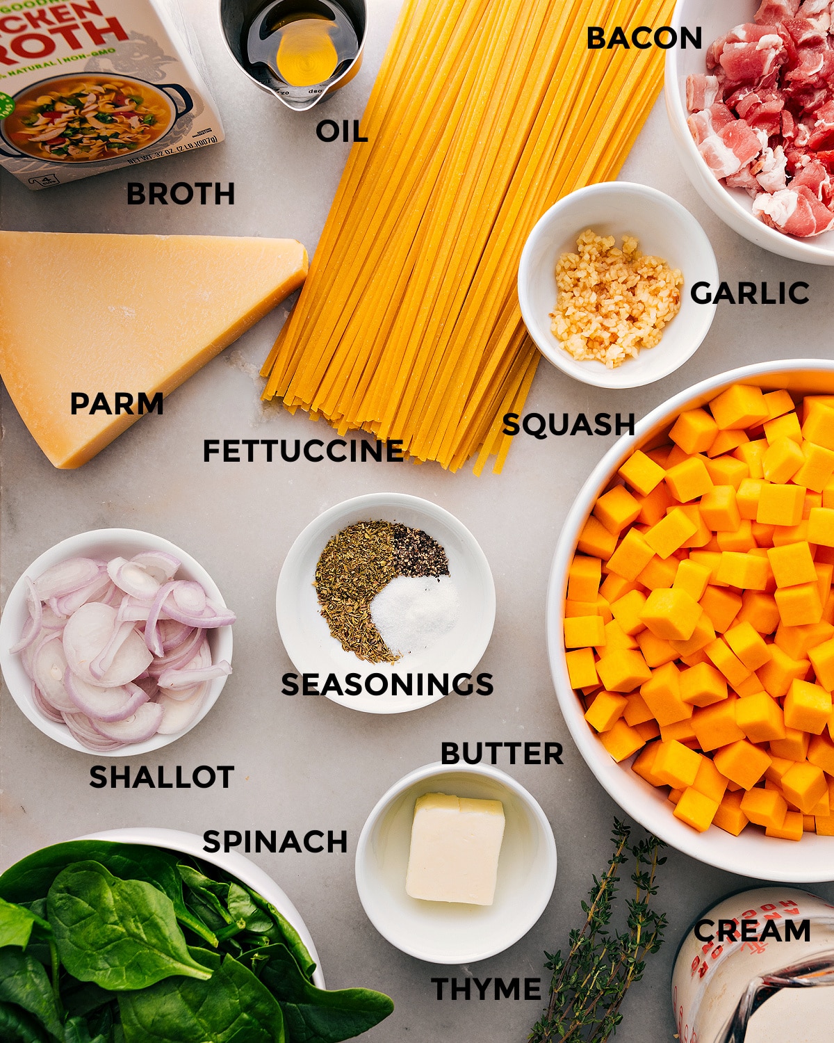 Ingredients In Butternut Squash Pasta Recipe All the ingredients for this recipe are prepped and ready for easy assembly, including fettuccine, garlic, bacon, oil, broth, parmesan, shallots, butter, and veggies.