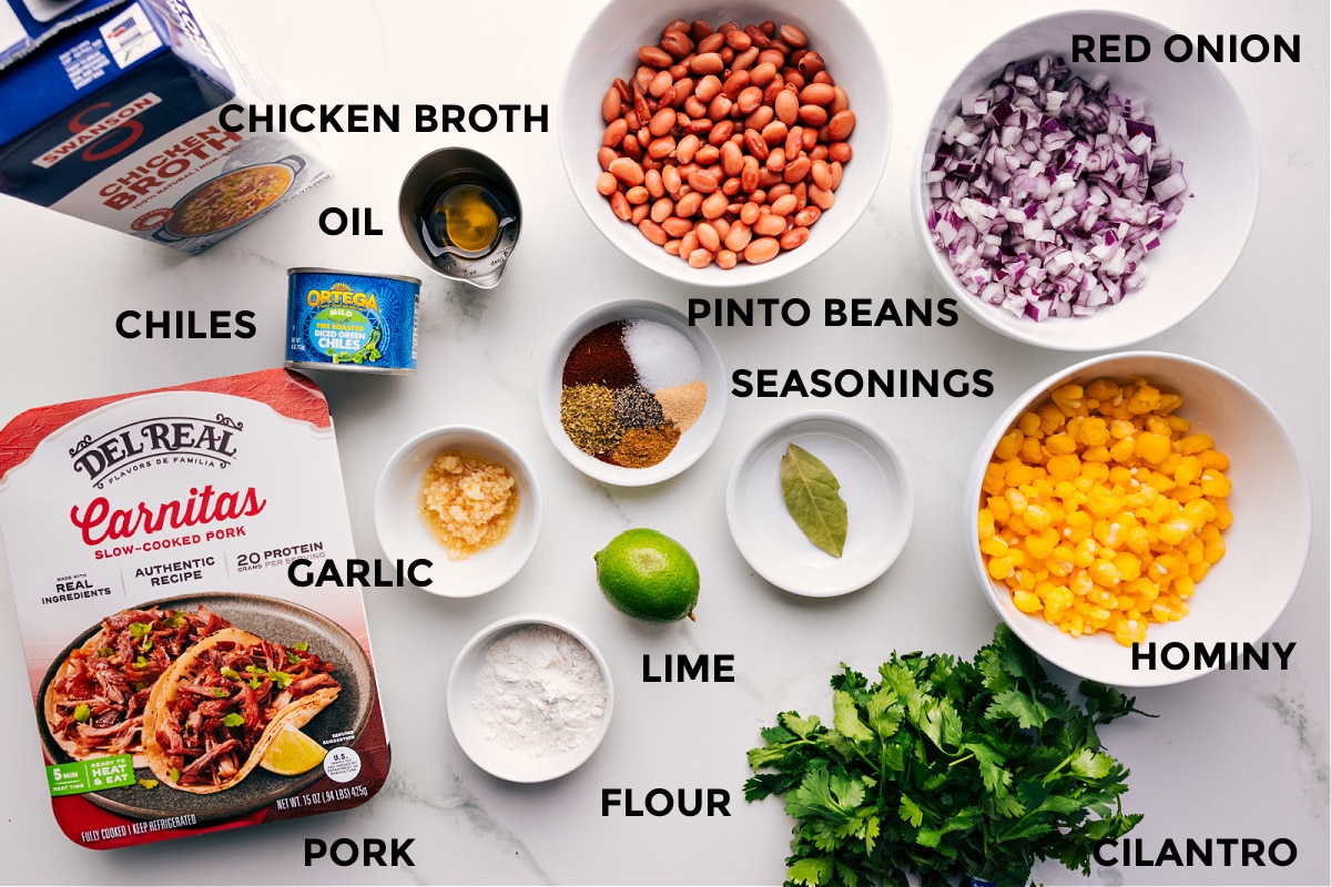 Ingredients In Pozole Recipe All the ingredients for this recipe prepped and ready for easy assembly, including broth, oil, chiles, garlic, pork, flour, limes, pinto beans, seasonings, hominy, cilantro, and red onions.