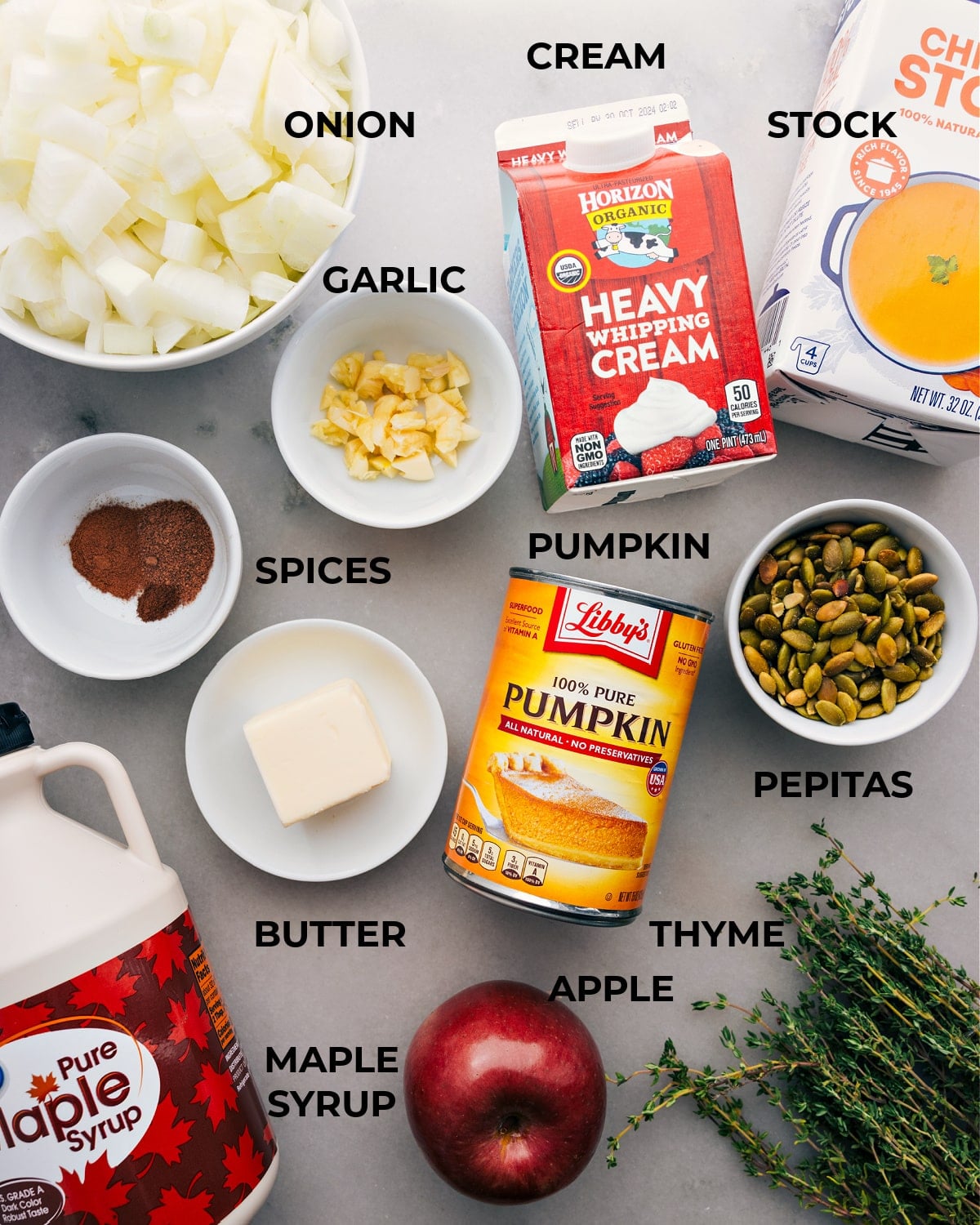 Ingredients In Pumpkin Soup All the ingredients for this recipe are prepped and ready for easy assembly, including onion, heavy cream, stock, spices, garlic, canned pumpkin, and pepitas.