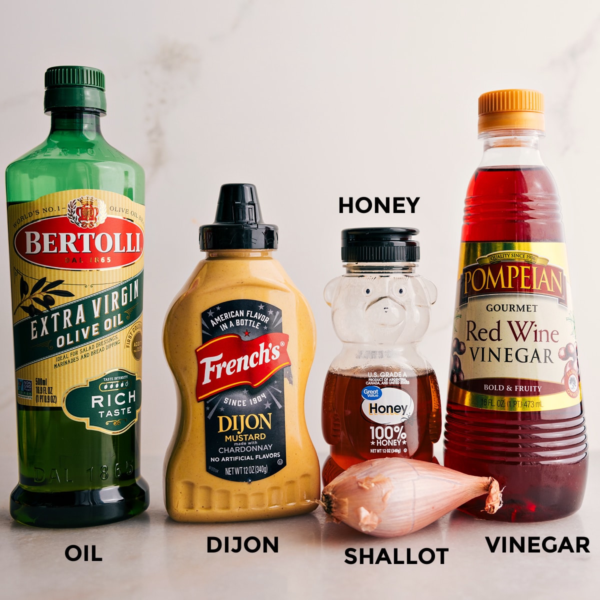 Ingredients In The Delicious Salad Dressing Recipe The dressing includes olive oil, mustard, honey, red wine vinegar, and a shallot.