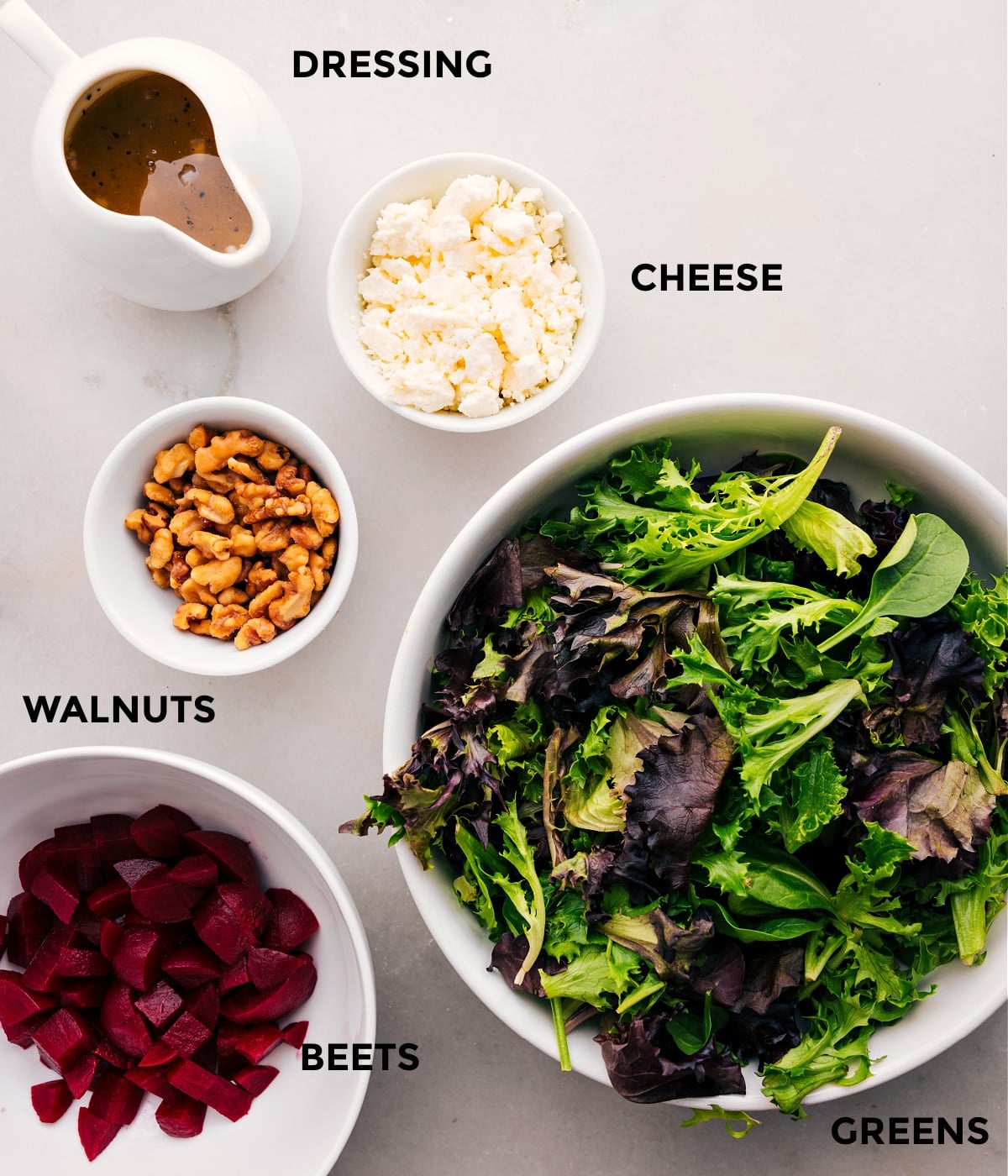 Ingredients For Beet Goat Cheese Walnut Salad Prepped Out All the ingredients for this beet goat cheese walnut salad—greens, cheese, walnuts, and beets—are prepped and ready for easy assembly.