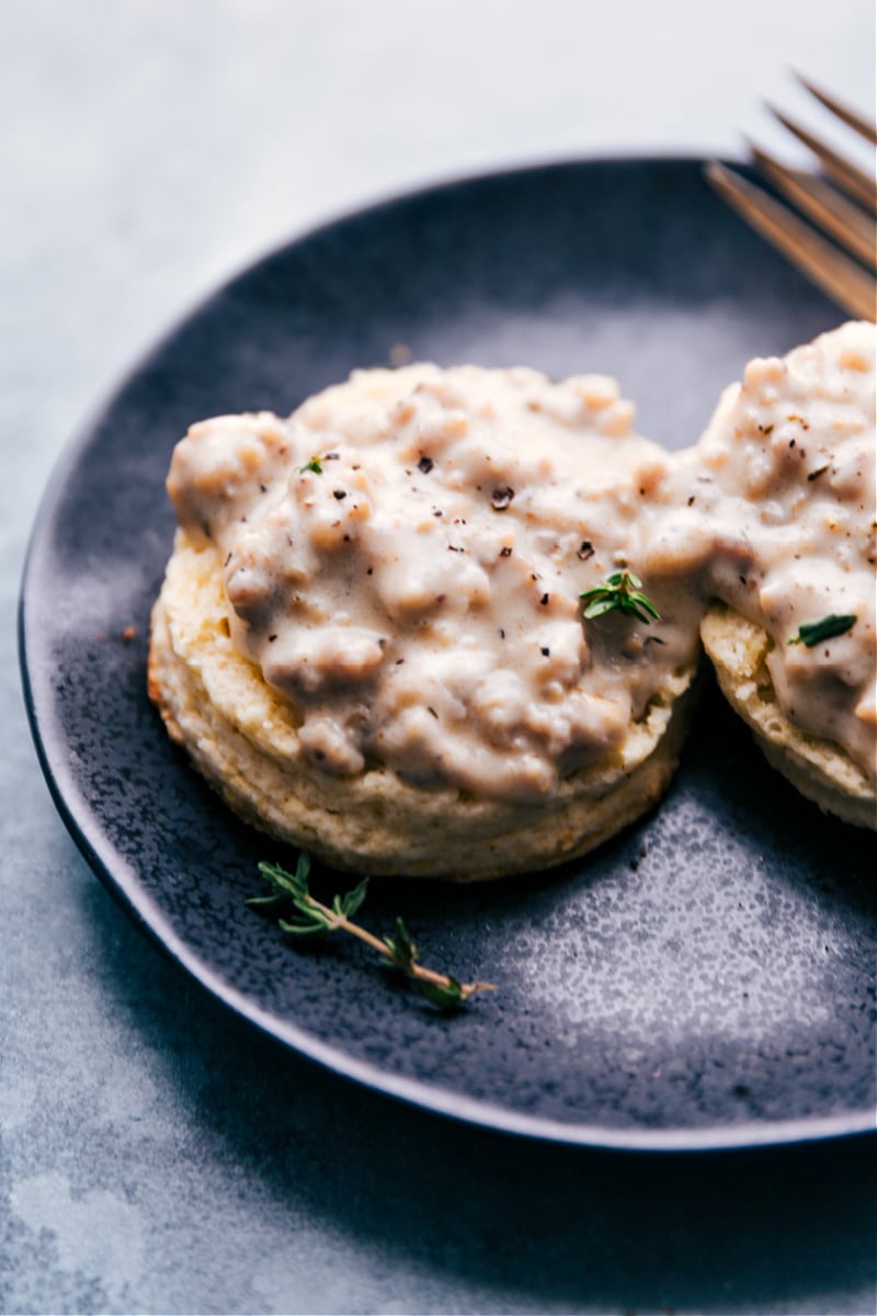 Biscuits and Gravy! Recipe via ChelseasMessyApron.com #biscuits #gravy #comfortfood #southern #sausage #breakfast #carbs Biscuits and Gravy on a plate