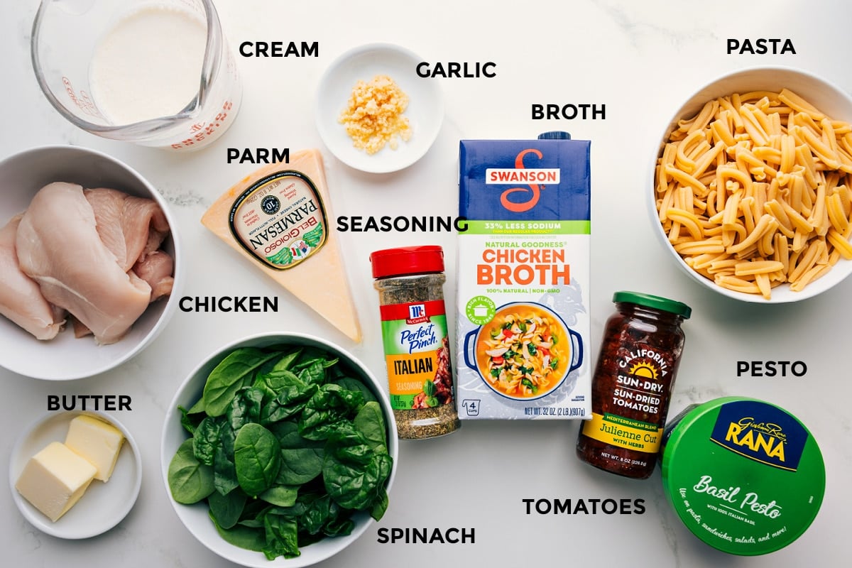 Ingredients In Marry Me Pasta All the ingredients prepped for easy assembly: pasta, pesto, tomatoes, broth, garlic, cream, Parmesan, seasonings, butter, spinach, and chicken.