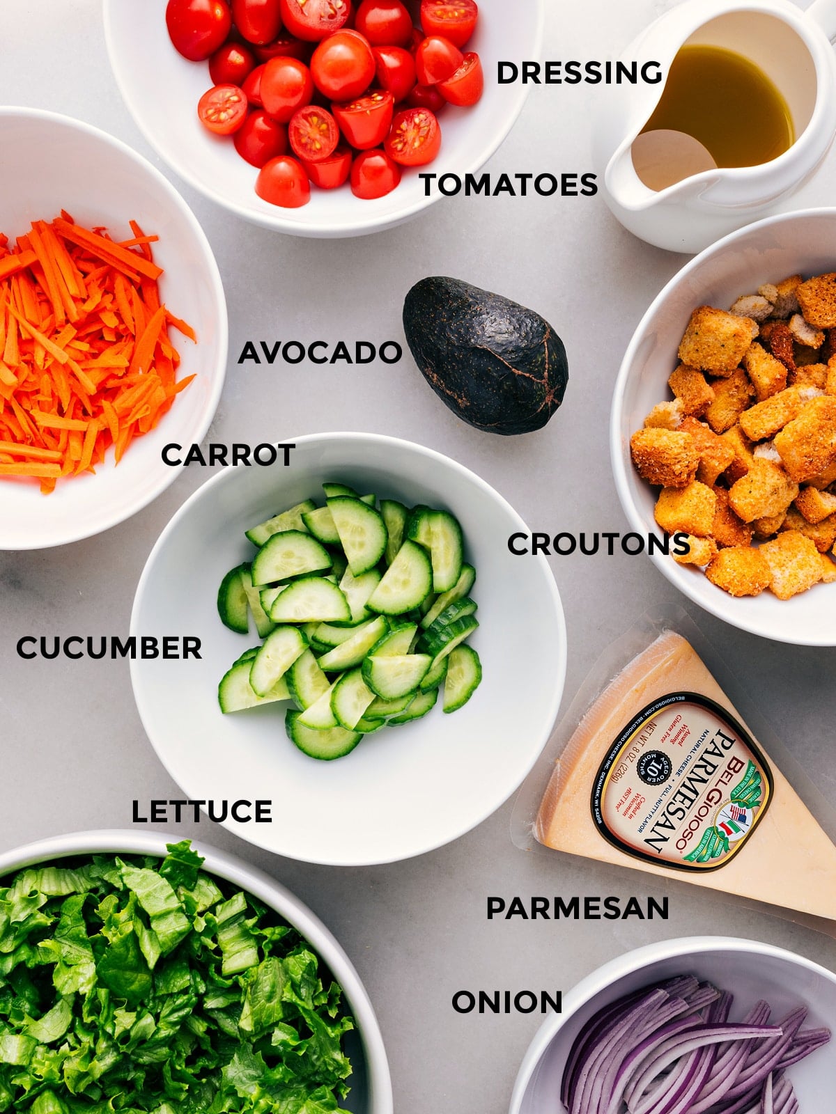 Ingredients In This Garden Salad Prep the avocado, lettuce, Parmesan, croutons, cucumbers, tomatoes, and dressing for easy assembly.