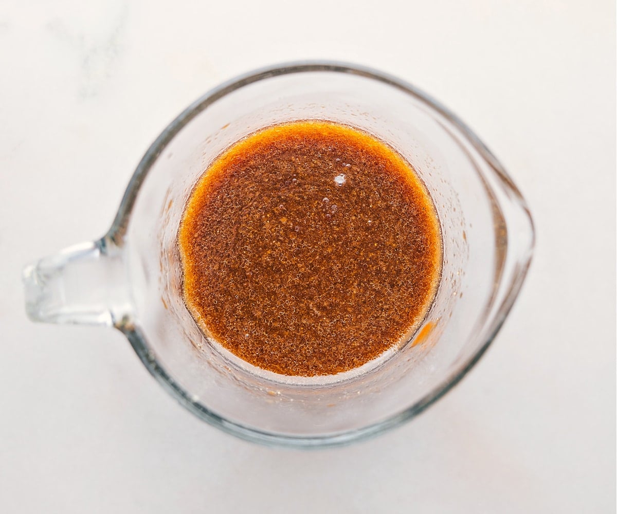 The Best Sauce In Pork Ramen Stir Fry Recipe The sauce for this Pork Ramen Stir Fry Recipe being whisked together in a liquid measuring cup.