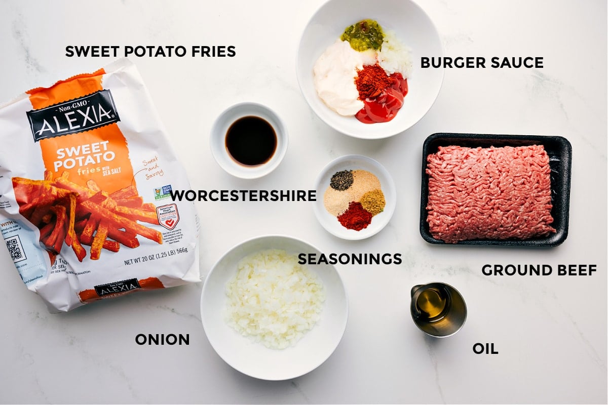 Ingredients In This Burger Bowl Recipe All the ingredients prepped for easy assemblyโsweet potato fries, burger sauce, Worcestershire, spices, ground beef, oil, and onion.